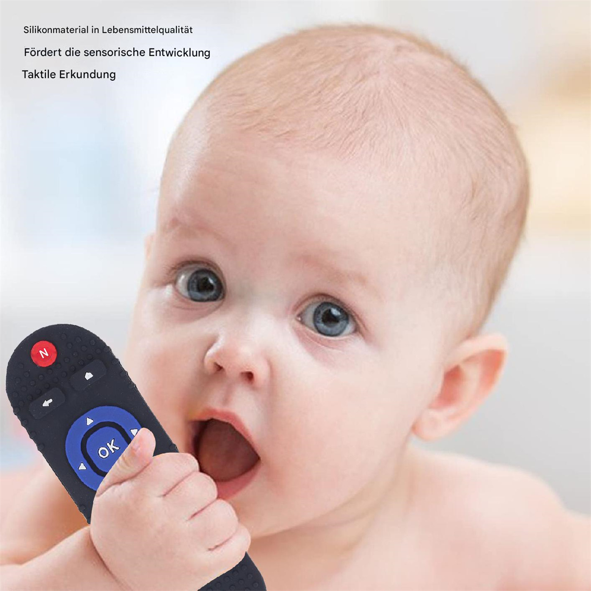 Baby mit Fernbedienung. Text sagt: Silikonmaterial, fördert sensorische Entwicklung.
