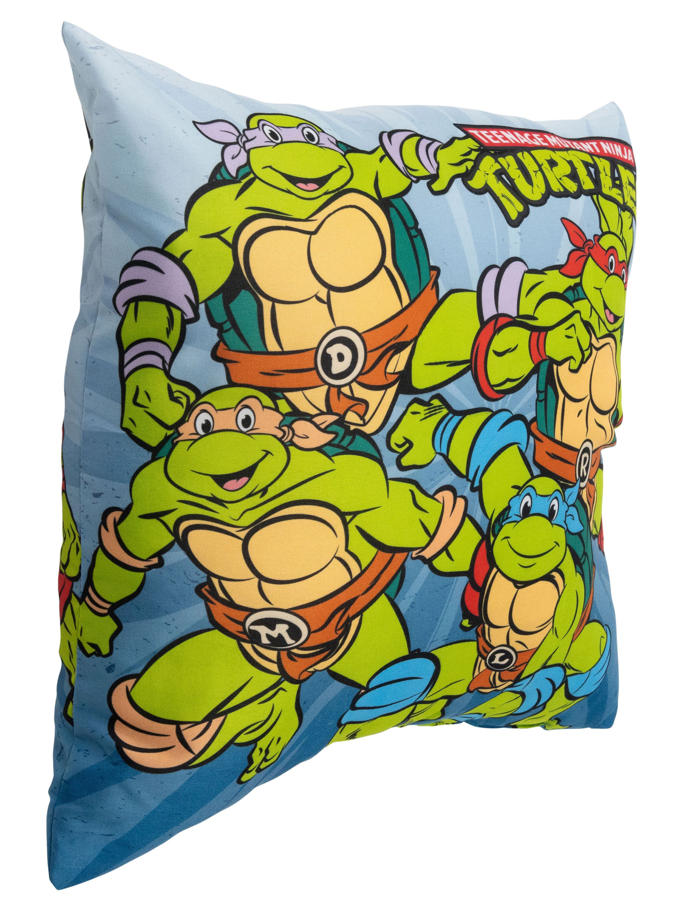Kissen mit Teenage Mutant Ninja Turtles-Figuren, grüne Schildkröten mit Bandanas, auf blauem Hintergrund.