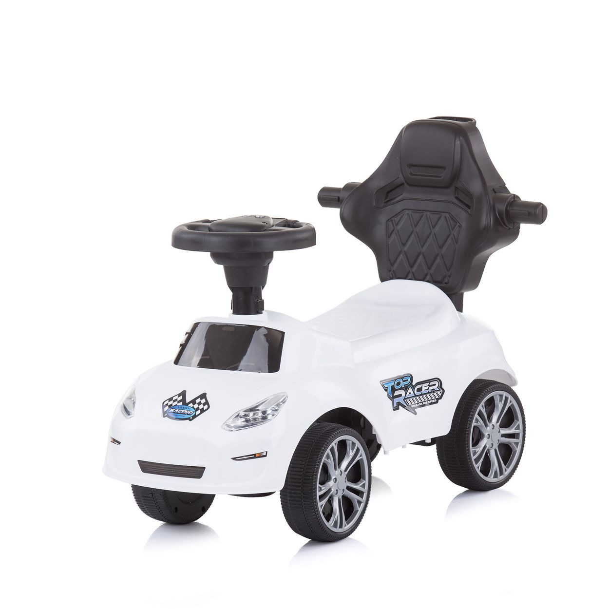 Coche de juguete blanco con detalles negros, volante y asiento negro. Fondo blanco.