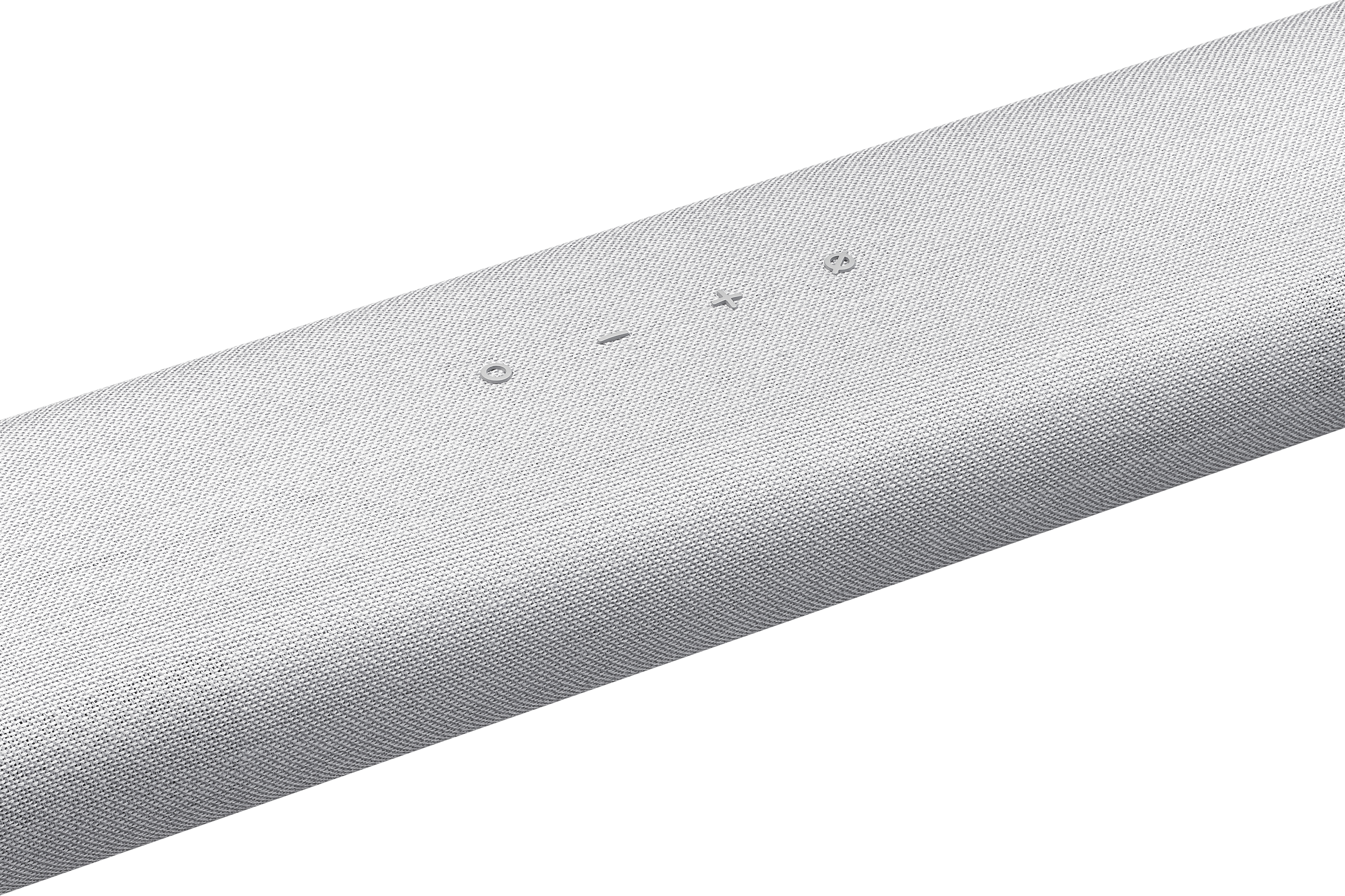 Un primo piano di una soundbar bianca con pulsanti di controllo sulla parte superiore.