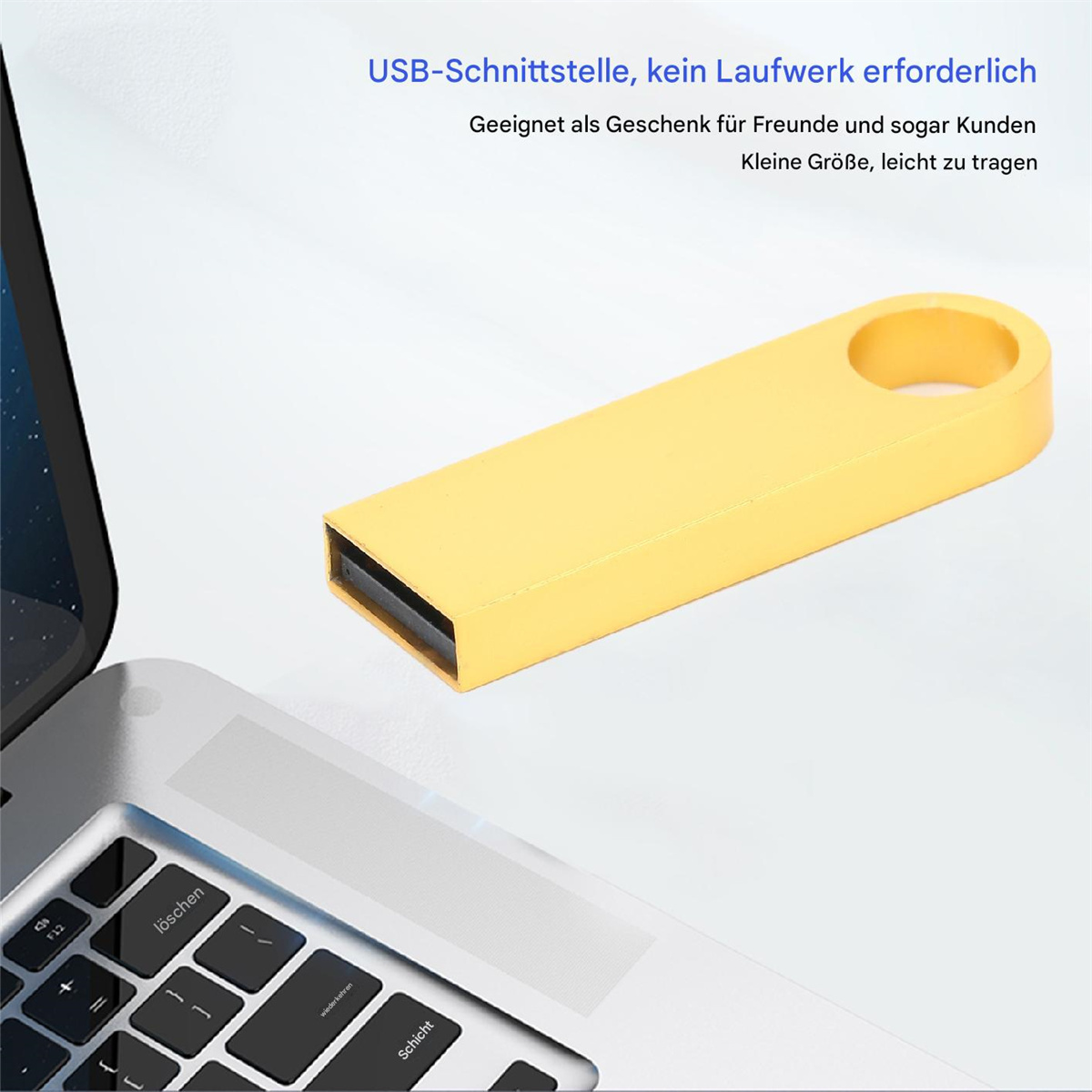 Gelber USB-Stick neben einer Laptop-Tastatur, mit Text über ein Geschenk.