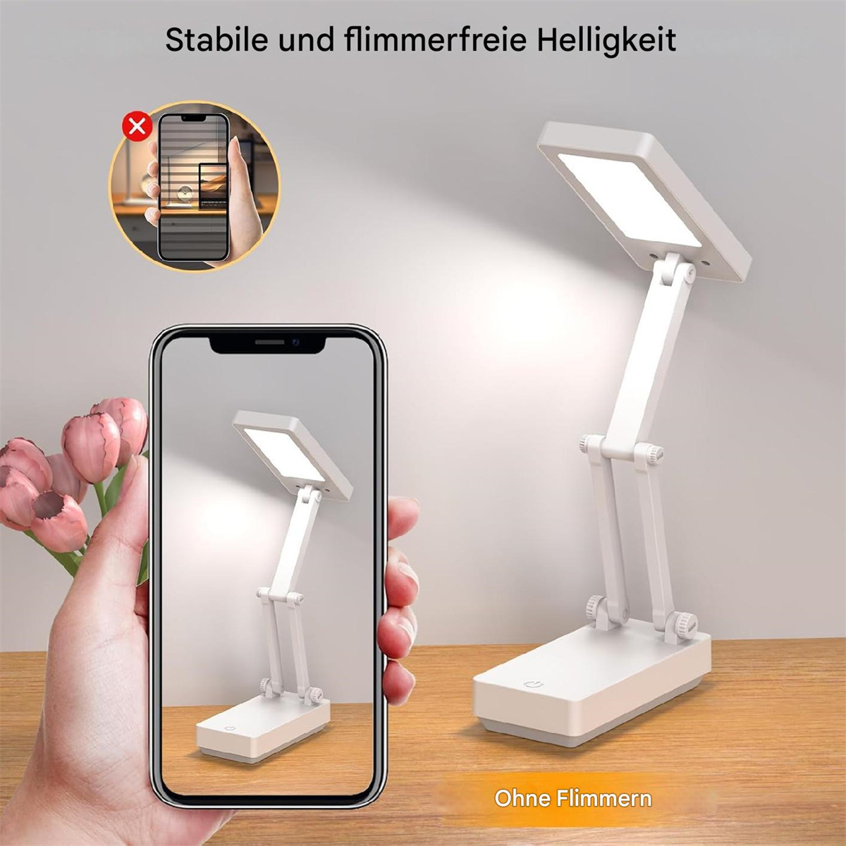 Faltbare weiße Schreibtischlampe. Auf Holzoberfläche, in Hand gehalten, mit Handy-Vergleichsbild.