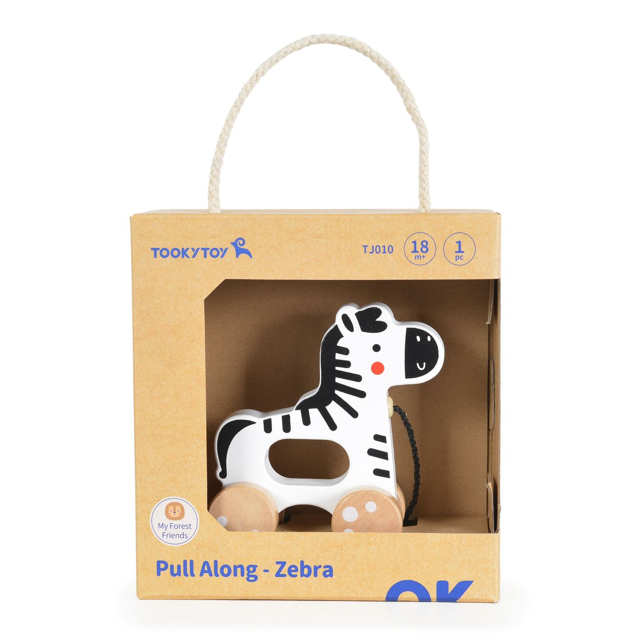 Ein Nachziehtier-Zebra in einem Pappkarton mit einer Schnur. Das Spielzeug ist weiß und schwarz.
