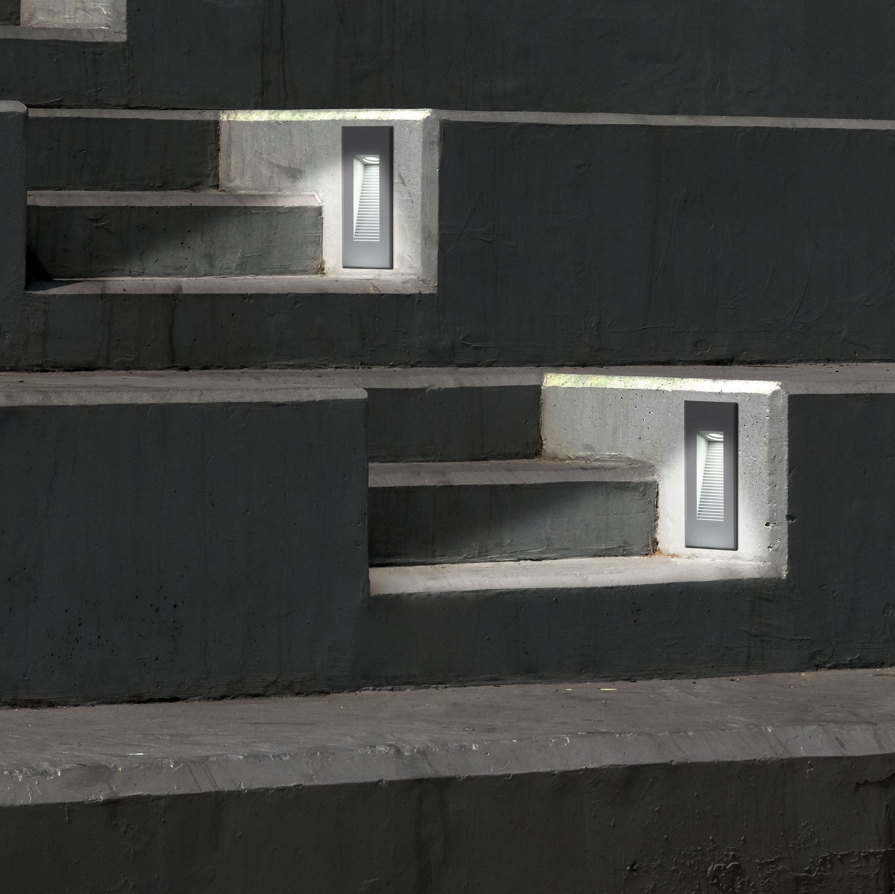 Betontreppen mit eingelassenen Lichtern. Die Lichter sind rechteckig und bündig mit der Oberfläche.