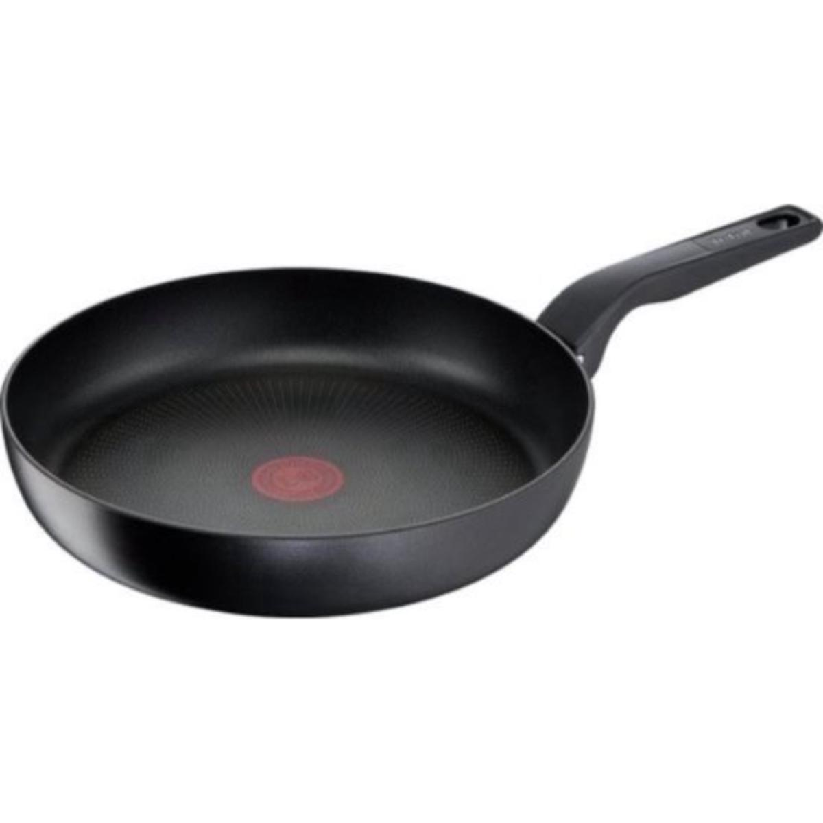 Black frying pan with a long handle. Red circle in the middle.