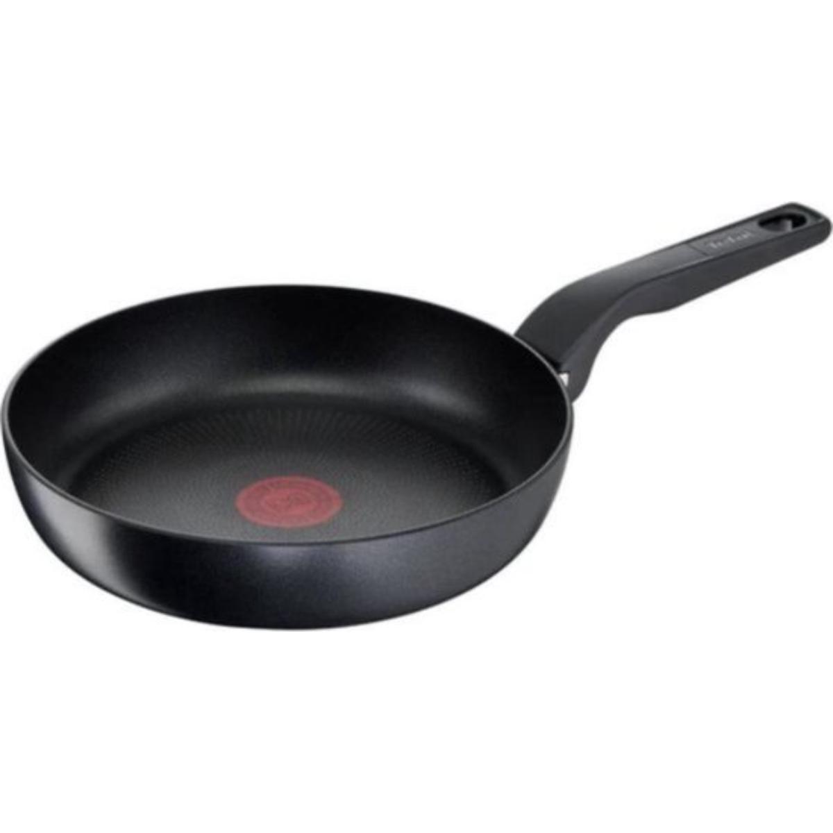 A black frying pan with a handle and a red dot in the center.