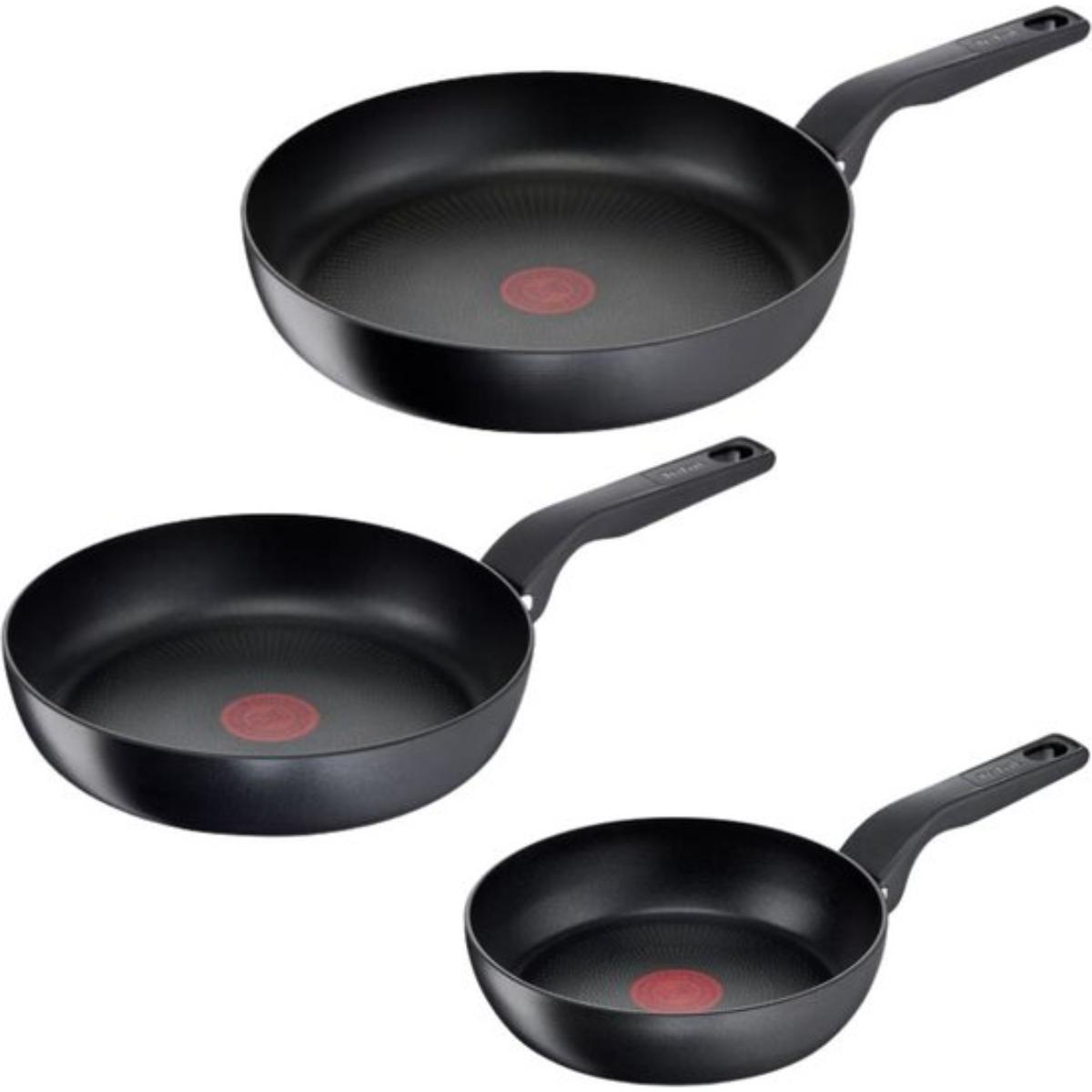 Three black frying pans with black handles. The pans have red circles in the center.