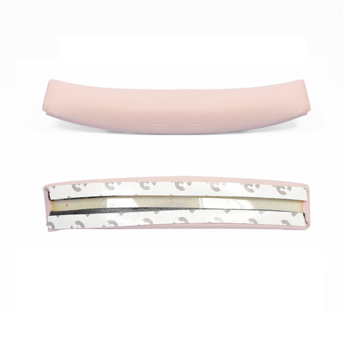 Dwie różowe poduszki zagłówka, jedna cała, druga z widoczną spodnią stroną z klejem.