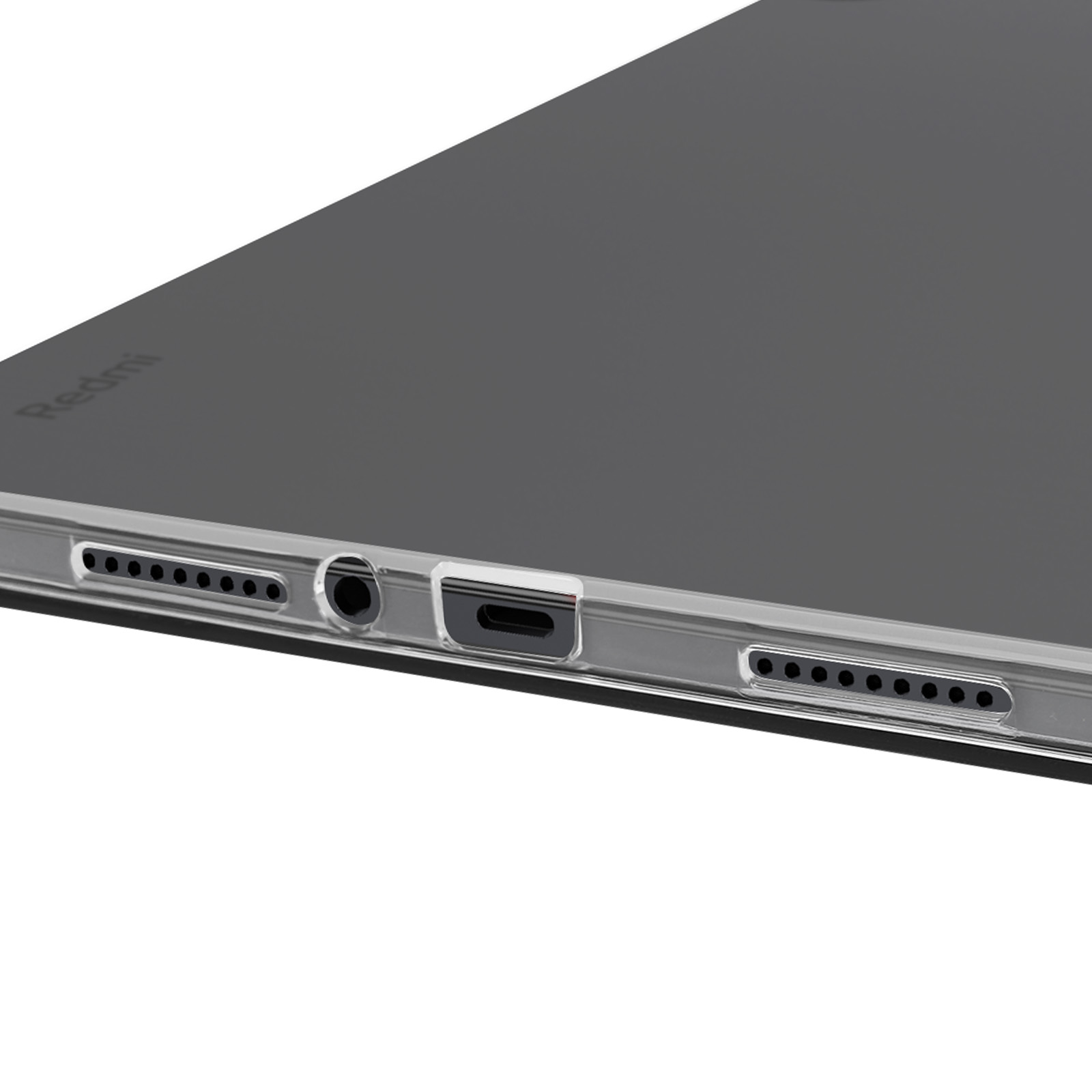 Primo piano del bordo inferiore di un tablet con una porta e fori per altoparlanti visibili.