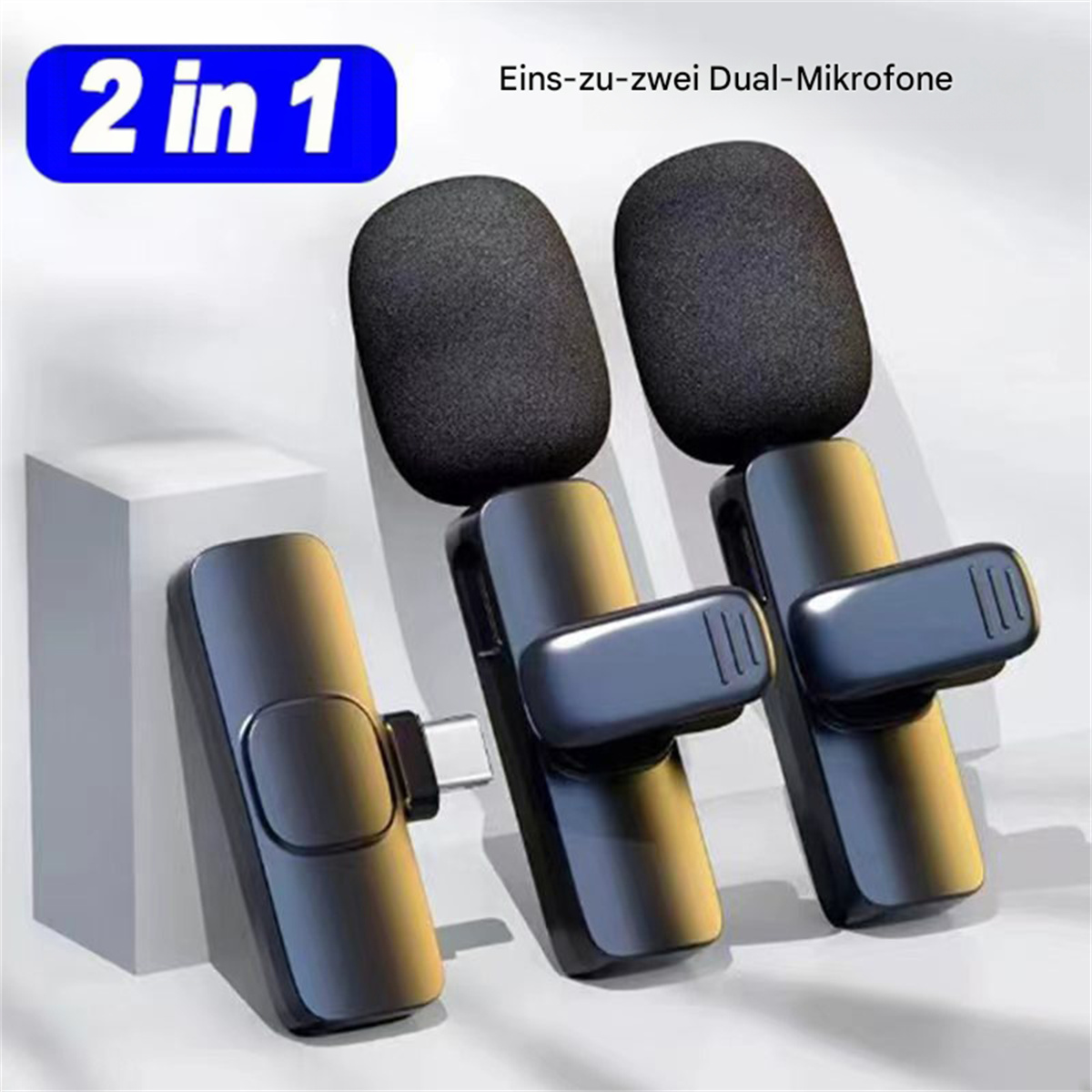 Zwei schwarze Mikrofone mit Schaumstoffabdeckungen, zur Aufnahme oder Audioeingabe.