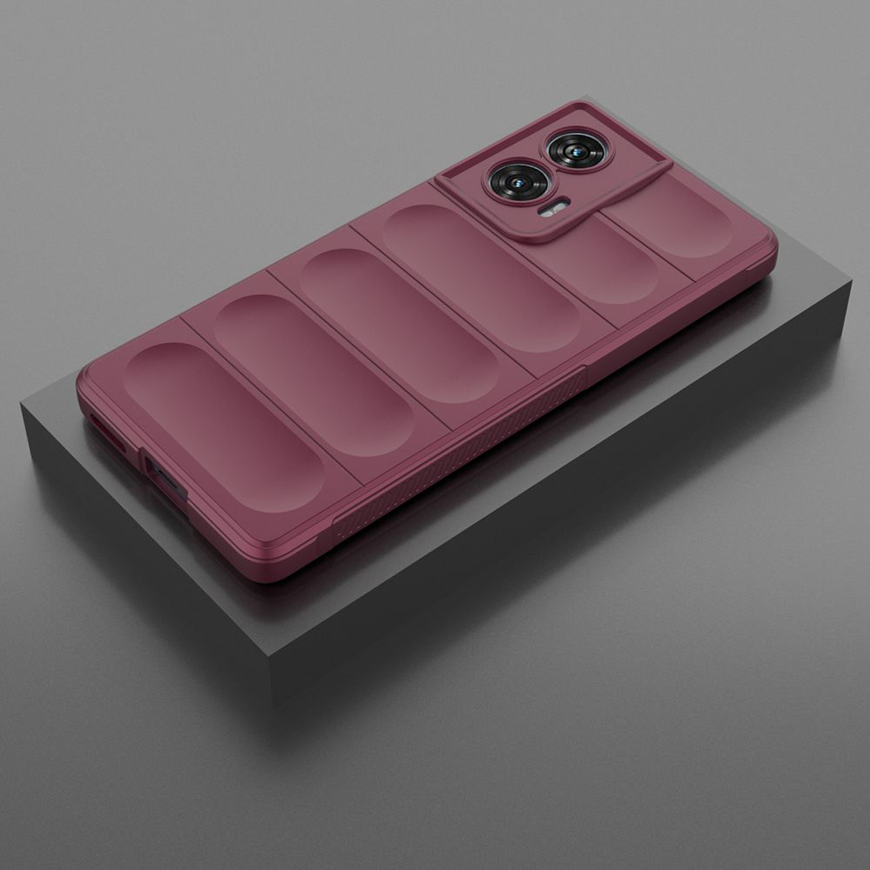 Coque de téléphone rouge, avec un design rectangulaire, sur une surface sombre.