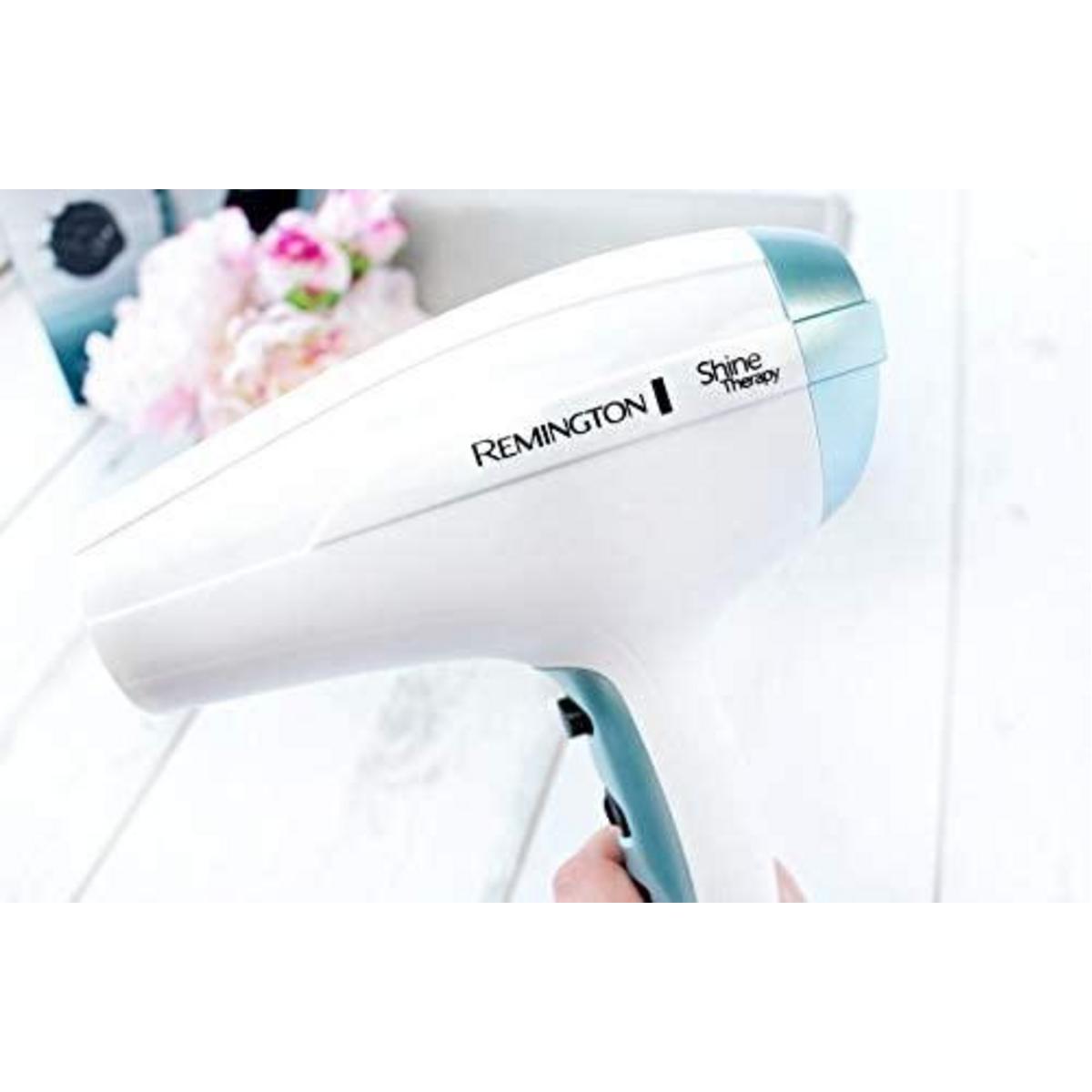 Asciugacapelli bianco e azzurro con la scritta REMINGTON e Shine Therapy.