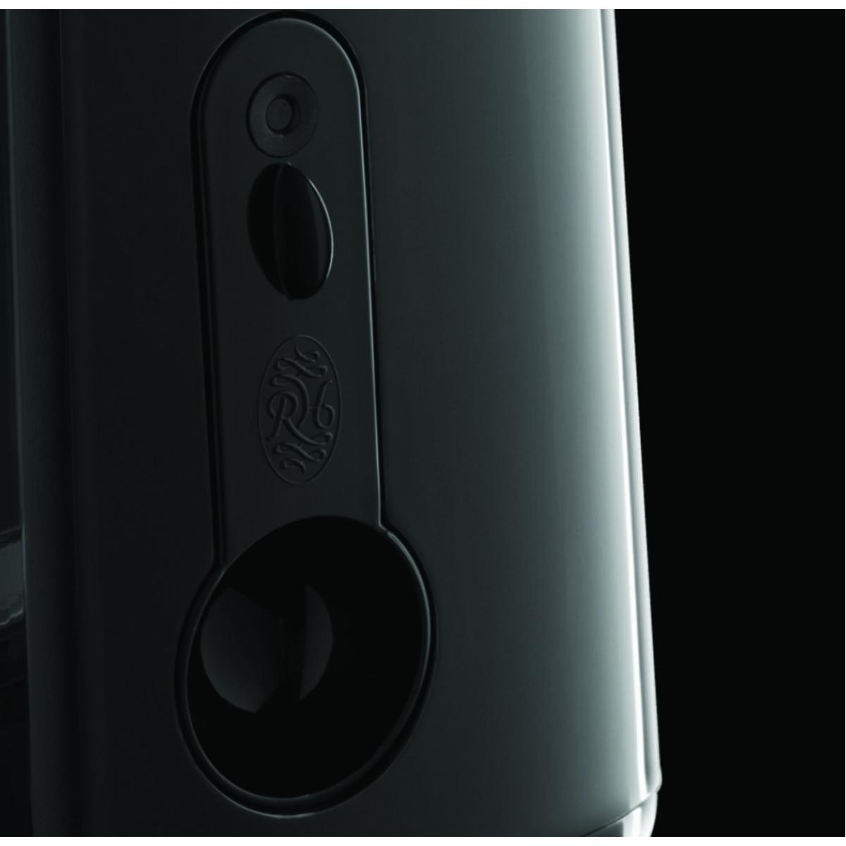 Czarny, błyszczący głośnik z okrągłym elementem dekoracyjnym.