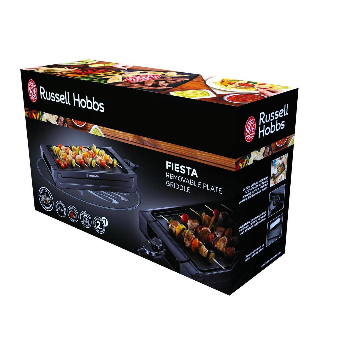 Üzerinde yiyecek olan bir Russell Hobbs ızgarası ile siyah ve kırmızı bir kutu.