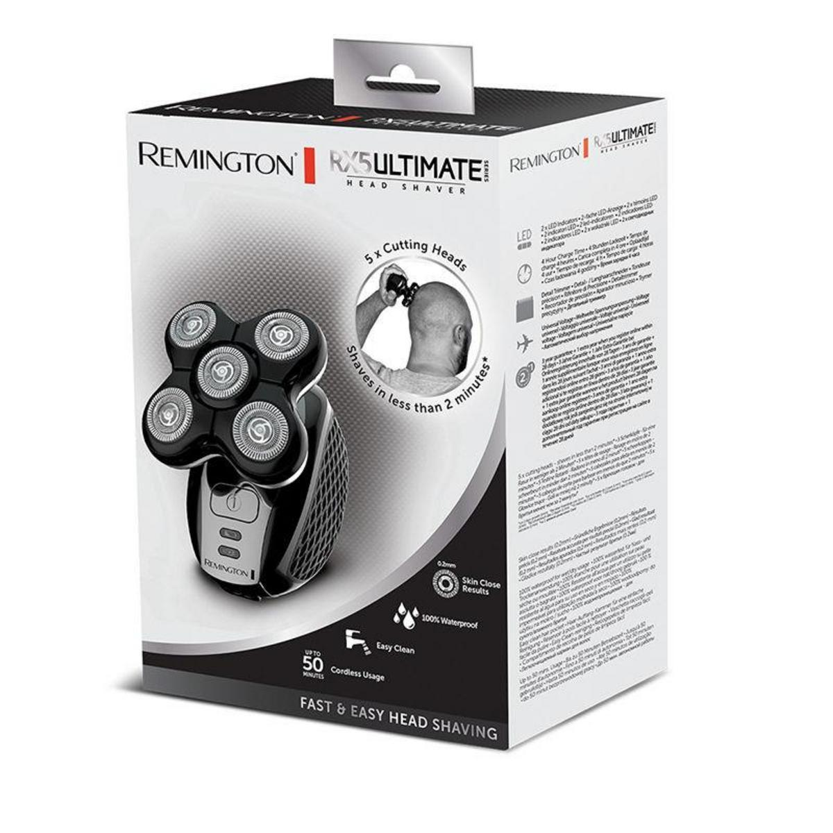 A box with a black and white head shaver and text about its features on a white background.