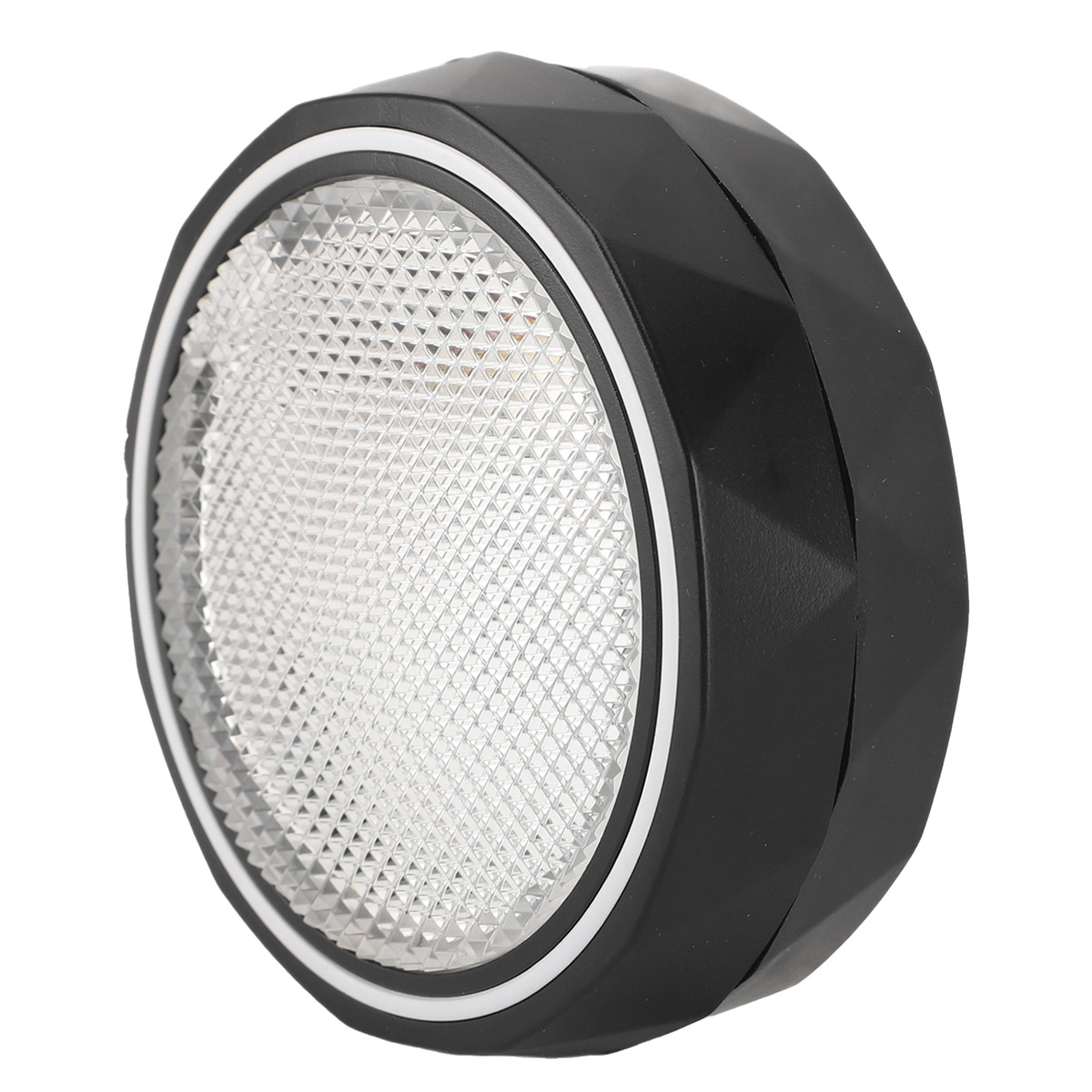 Ein schwarzes Licht mit einem rautenförmigen Muster in der Mitte, umgeben von einem weißen Ring.