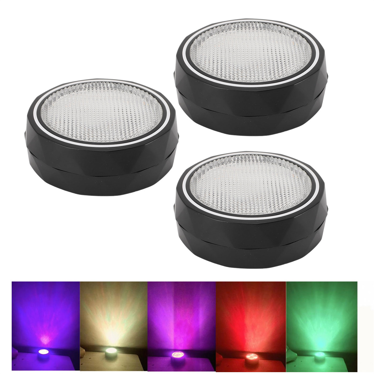 Drei schwarze Lichter mit silbernem Rand und eine Lichtshow in verschiedenen Farben.