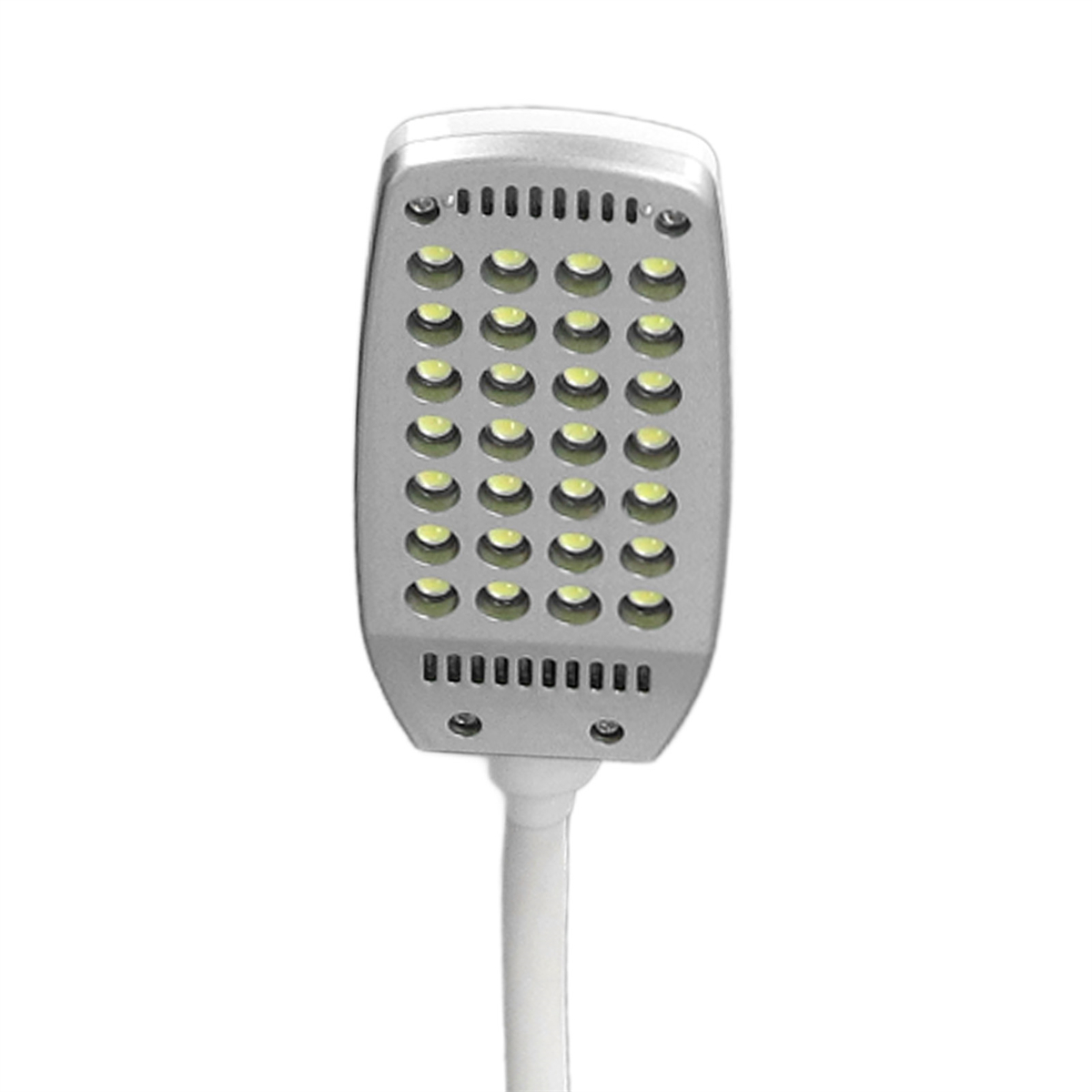 Silberne rechteckige LED-Leuchte mit vielen kleinen gelben Lichtern, montiert auf einem weißen Ständer.