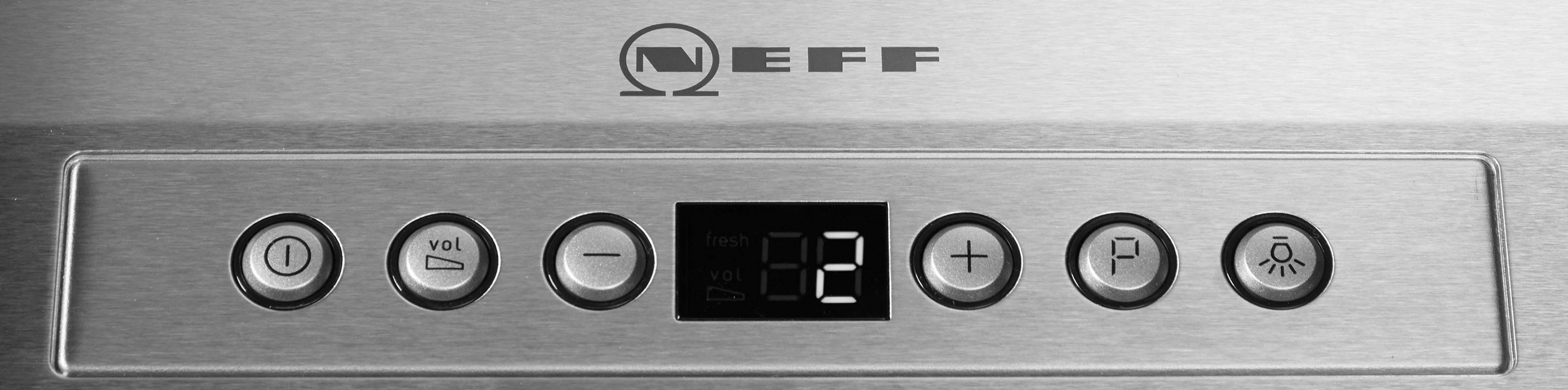 Un primo piano del pannello di controllo di un elettrodomestico Neff con pulsanti e un display.