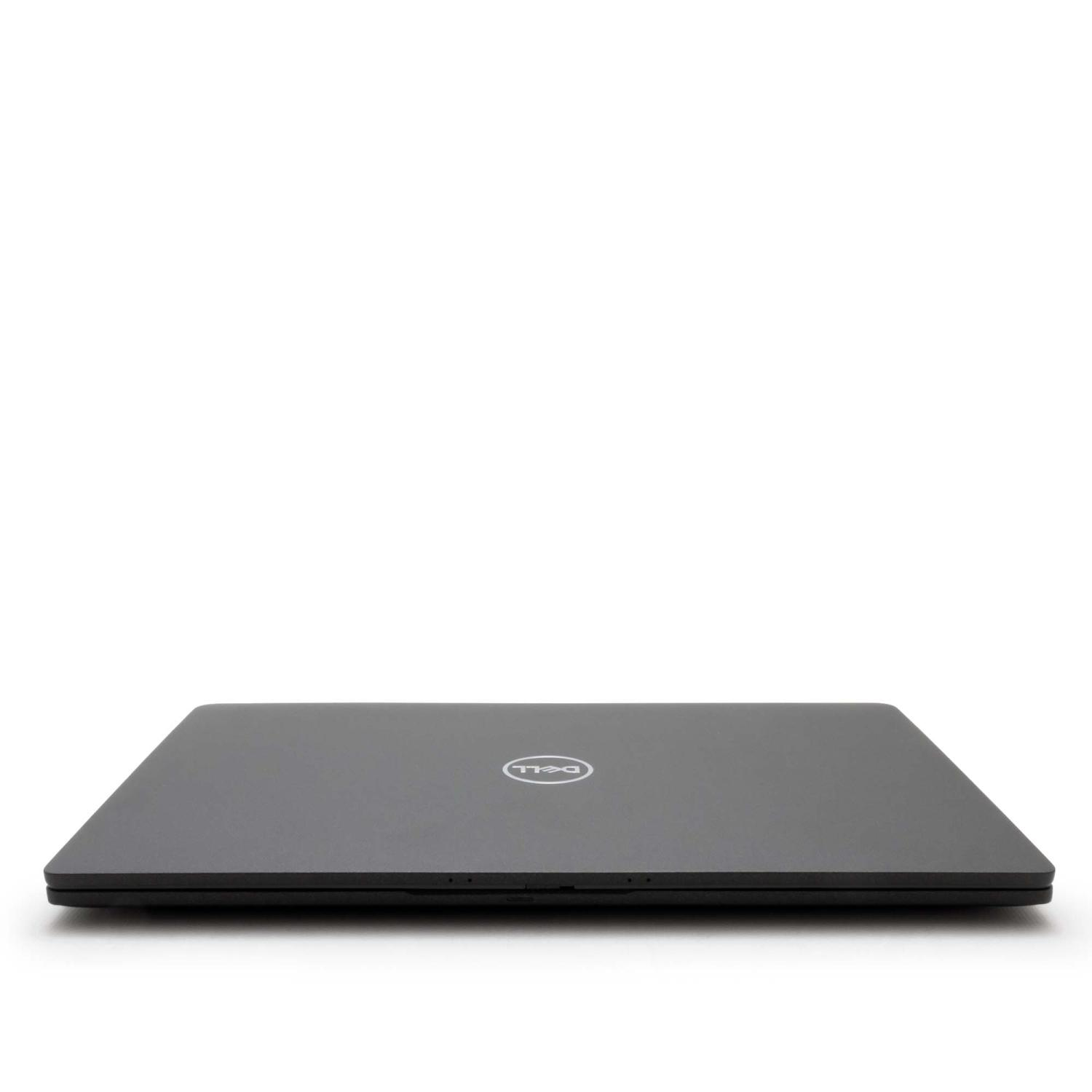 Laptop geschlossen, schwarze Farbe, auf einer weißen Oberfläche. Dell-Logo ist sichtbar.