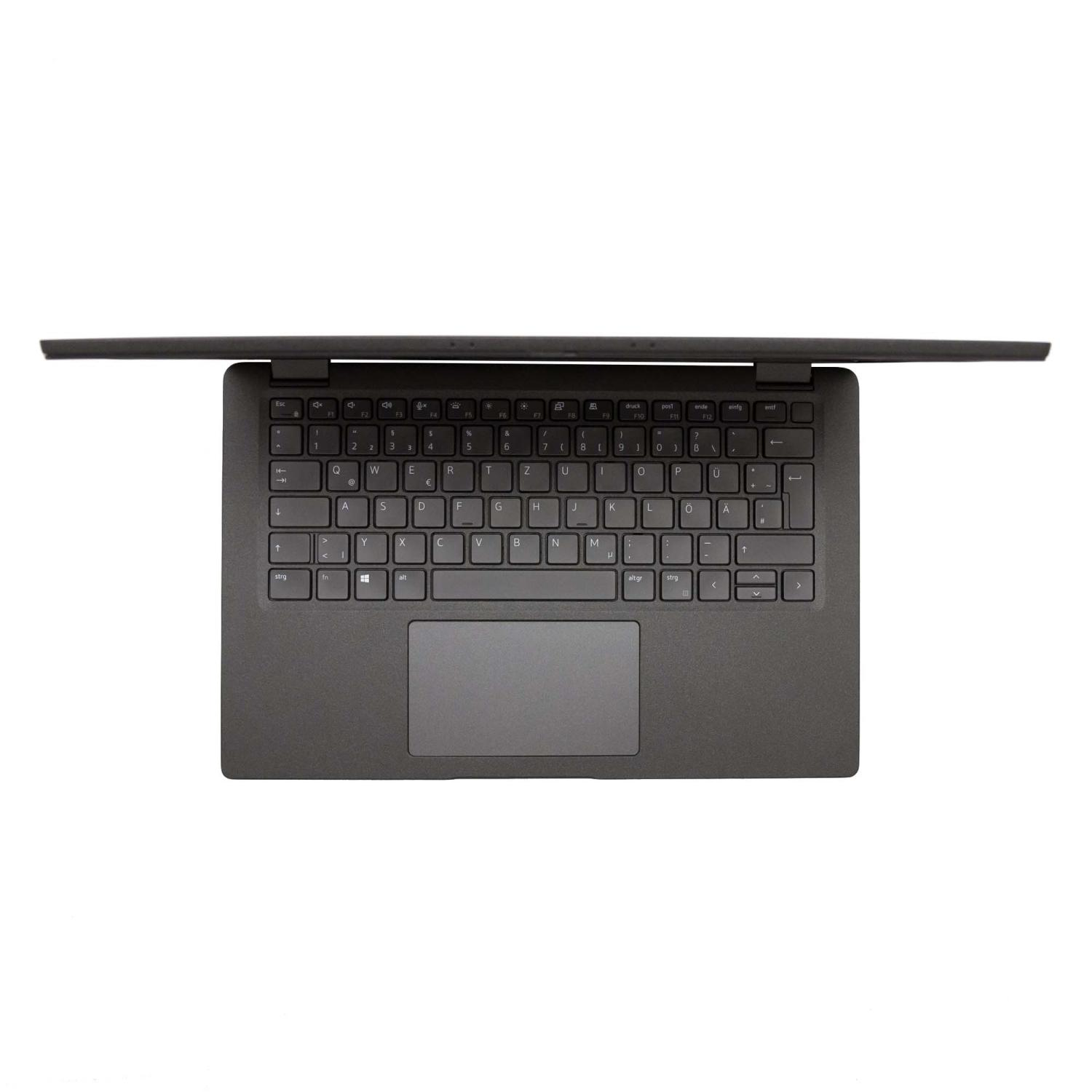 Ein schwarzer Laptop, geöffnet, Draufsicht. Tastatur und Trackpad sind sichtbar.