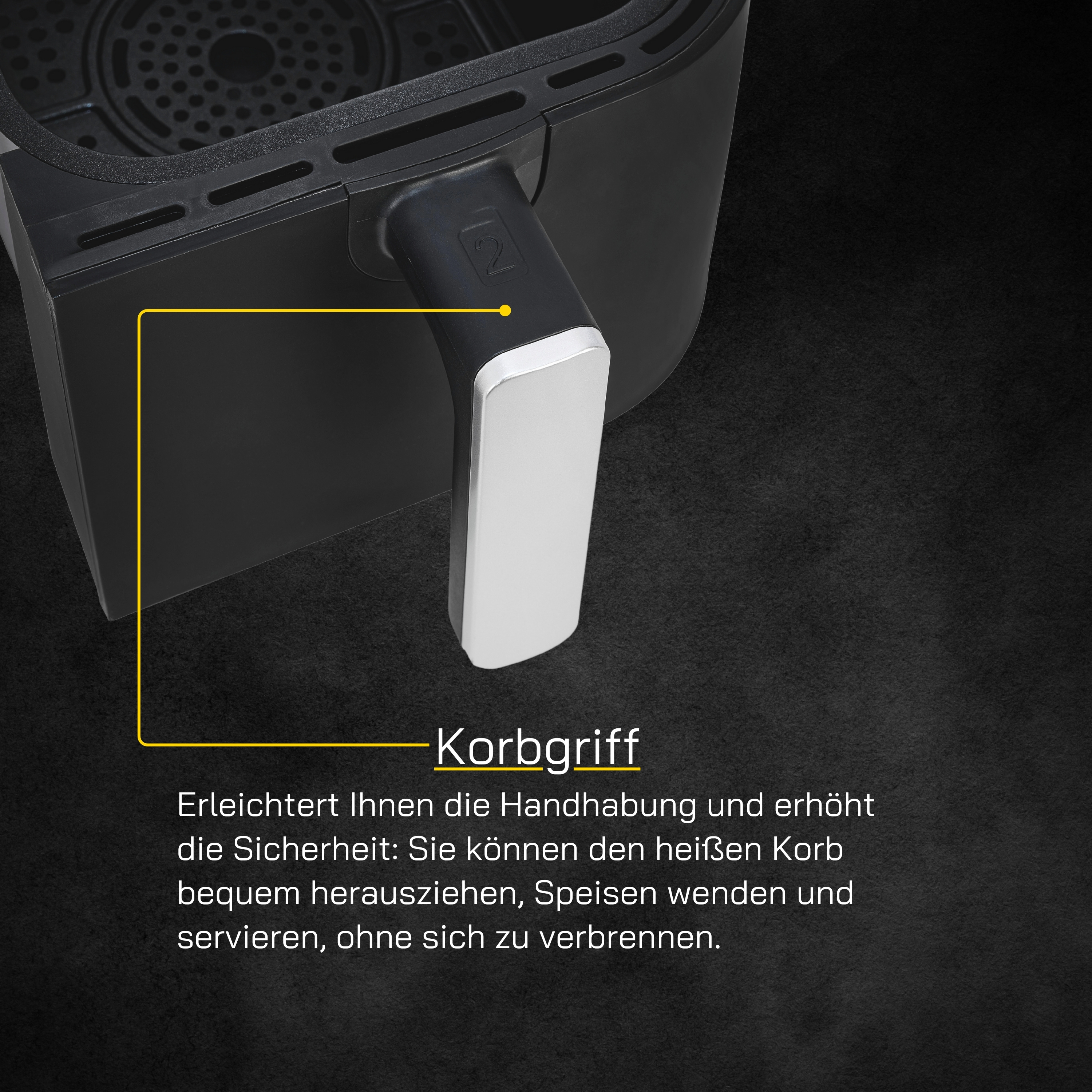 Nahaufnahme eines schwarzen Airfryers mit silbernem Griff, Text auf Deutsch.