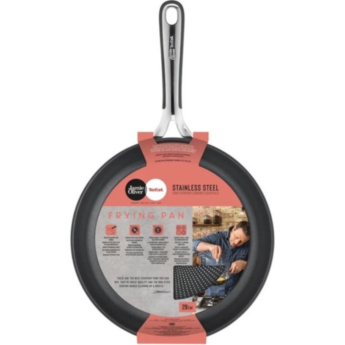Black Jamie Oliver frying pan with a silver handle and a red label. The package shows a man cooking.