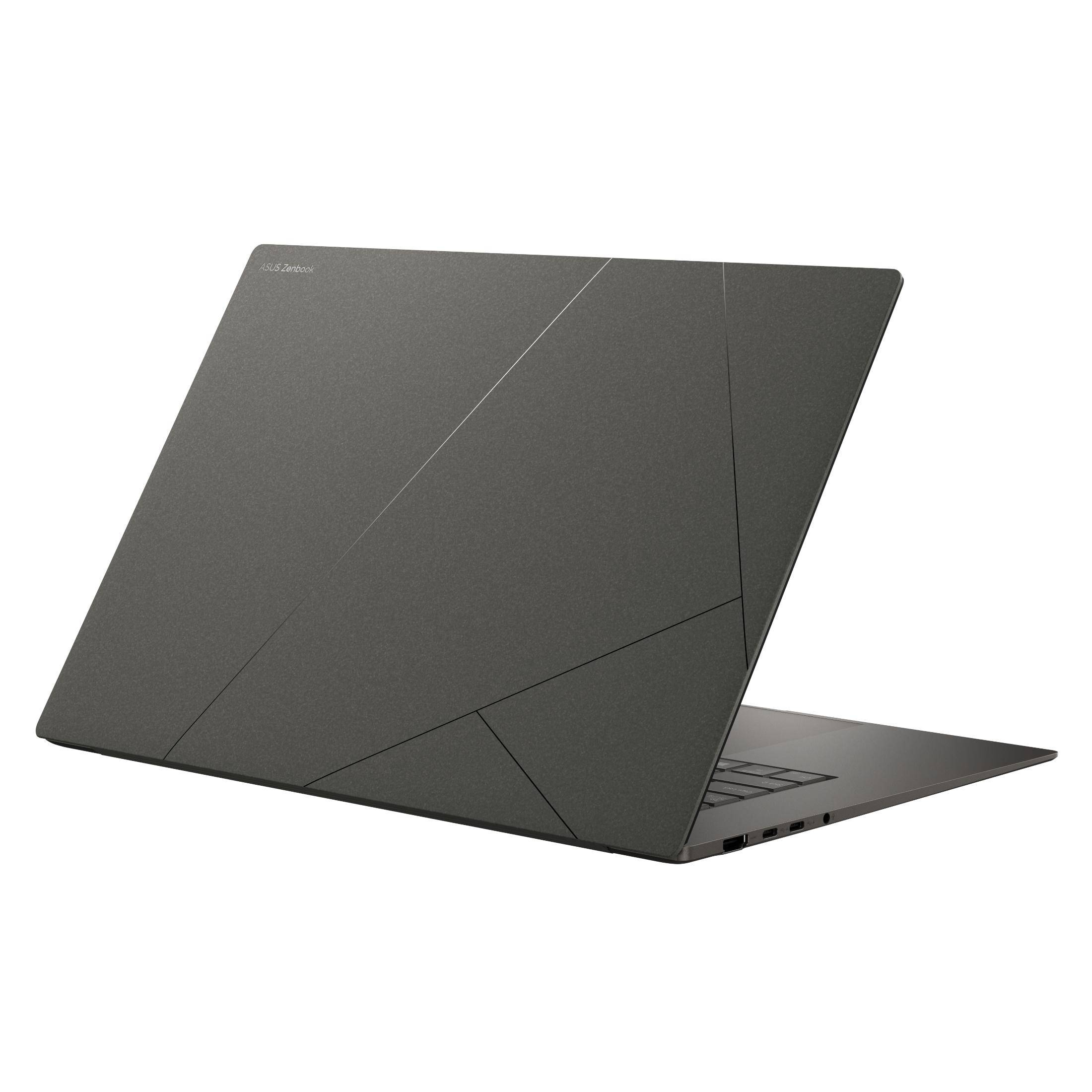 Ein grauer Laptop, Rückansicht, mit einem geometrischen Muster auf dem Deckel.