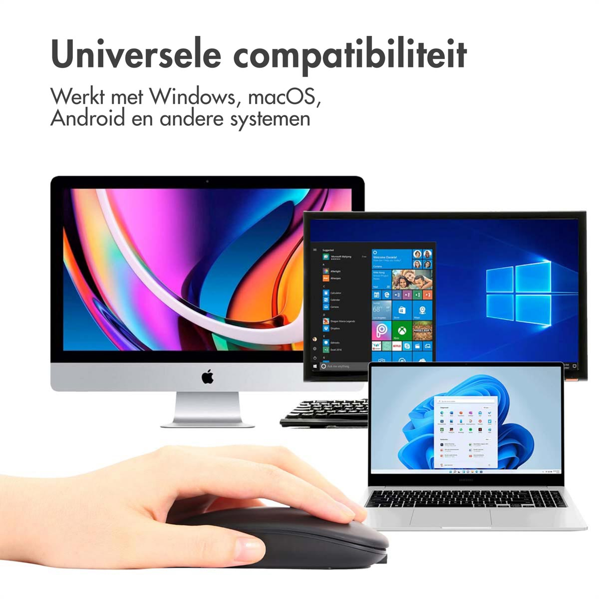 A hand using a mouse. There are two laptops and a computer monitor.