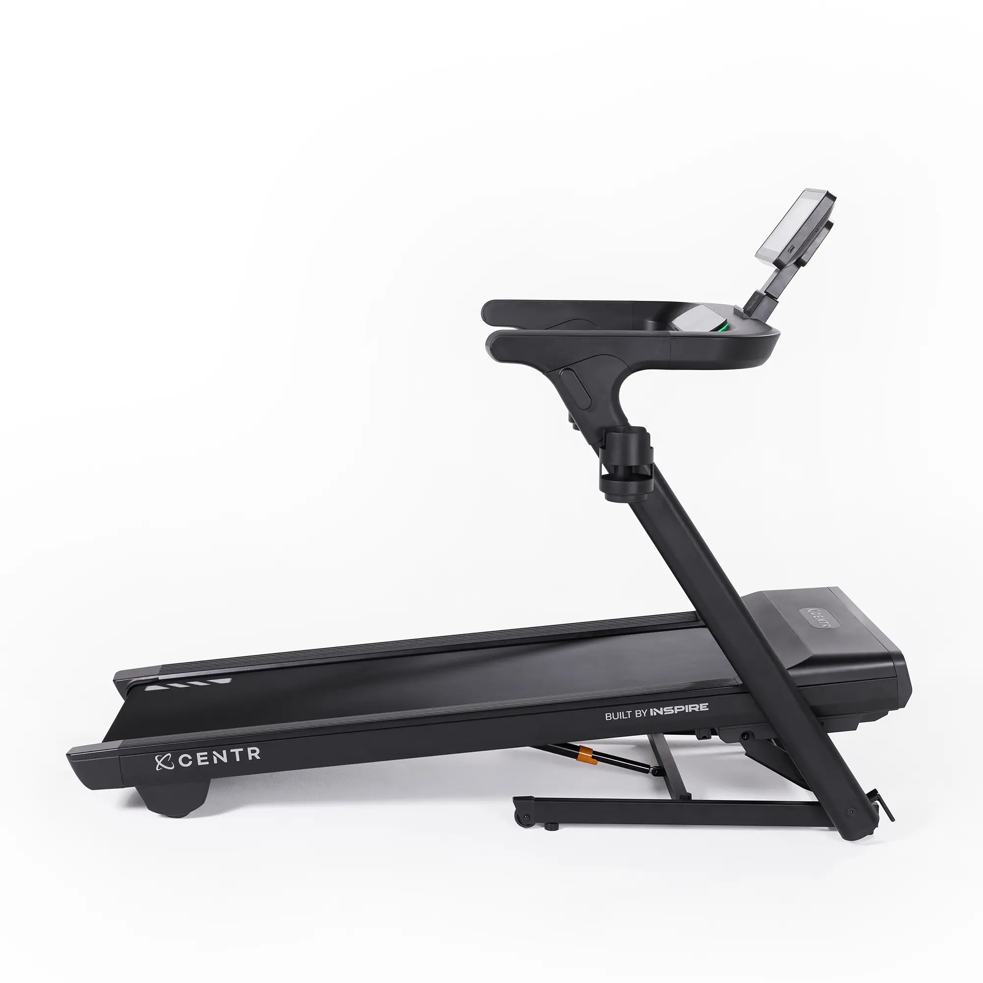 Black treadmill with screen, white background. Built by Inspire.