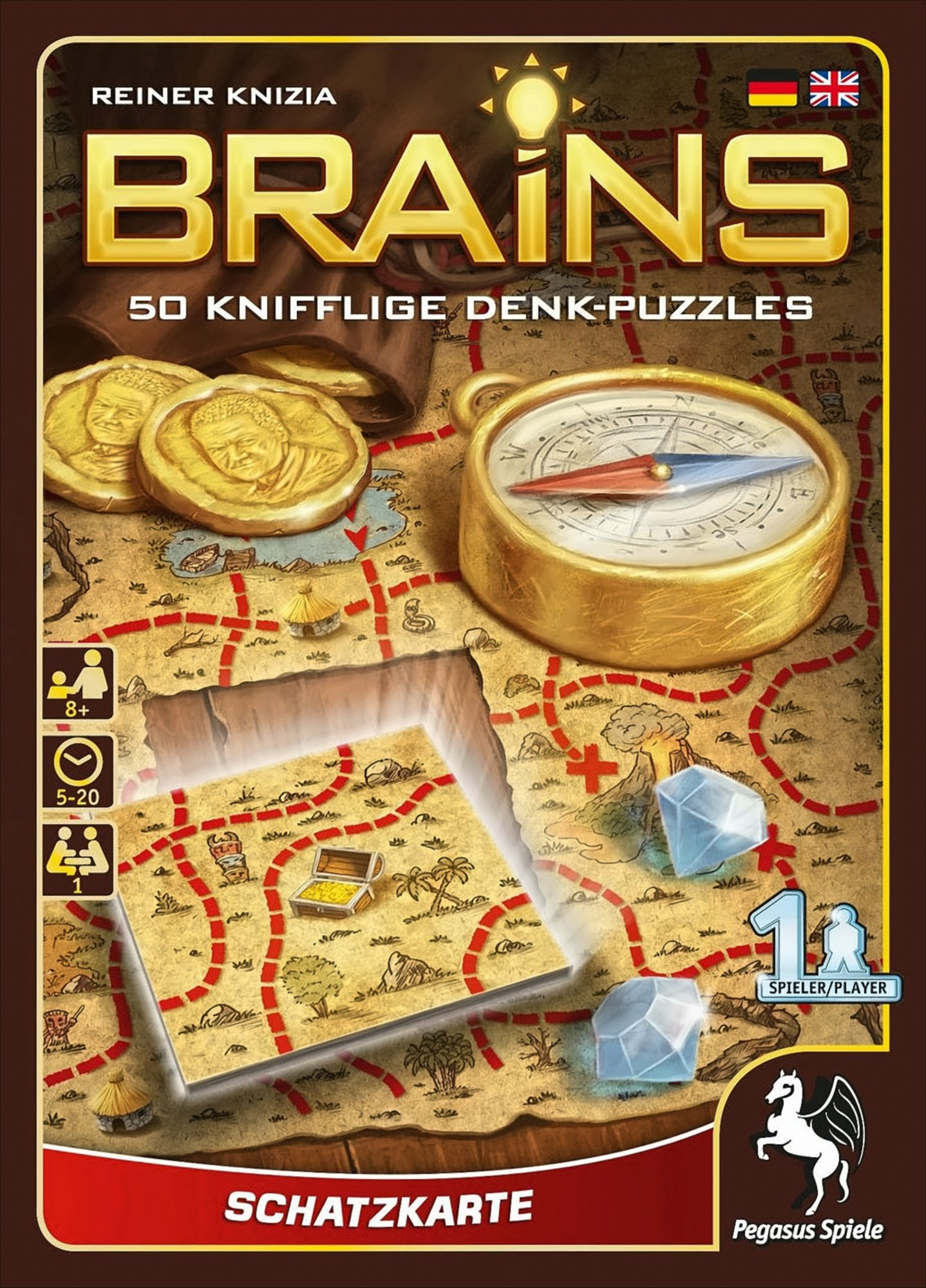 Brettspielbox mit Goldmünzen, Kompass und Karte. Die Box zeigt den Titel des Spiels.
