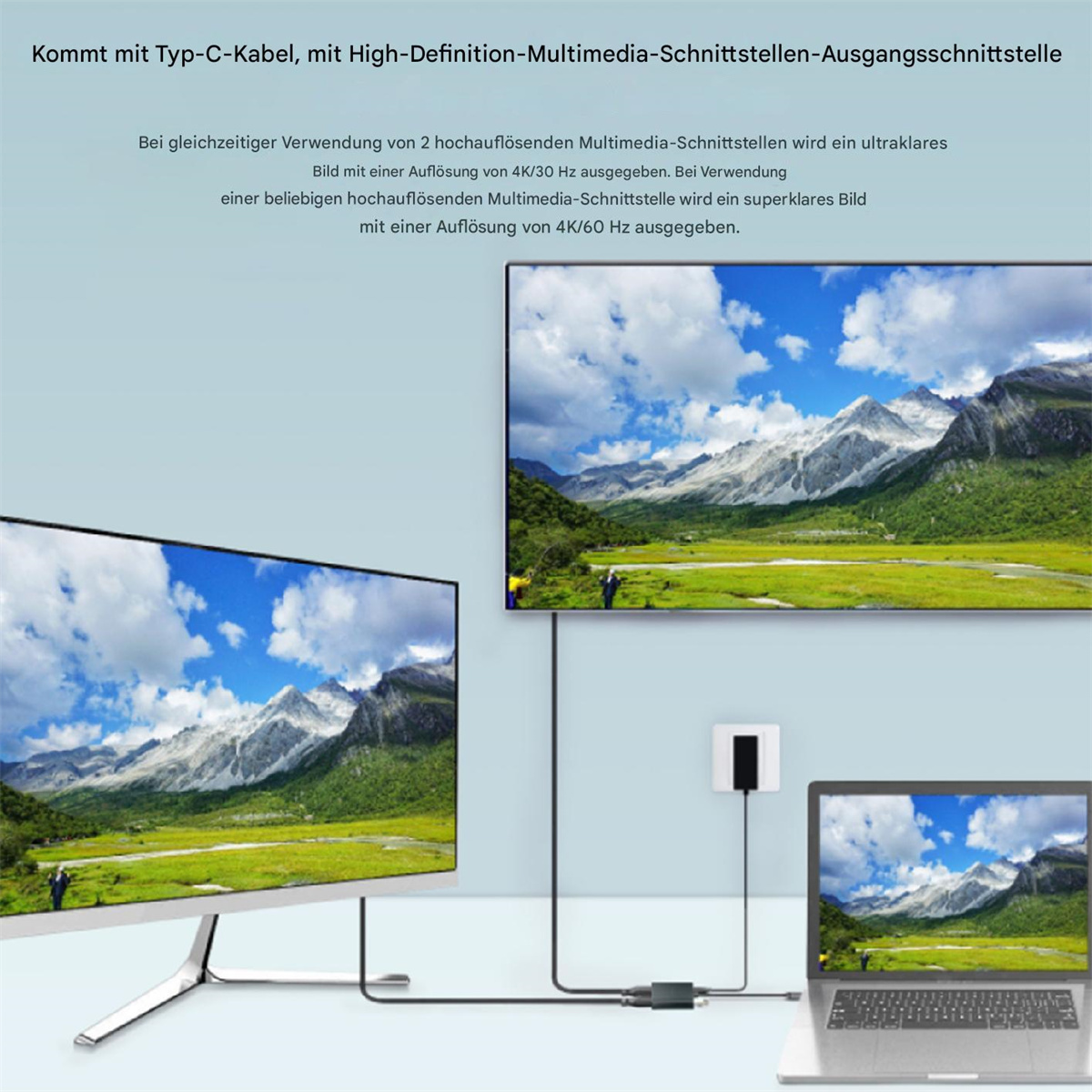 Mehrere Monitore und ein Laptop, die mit einem Typ-C-Kabel verbunden sind. Zeigt Berge auf dem Bildschirm.