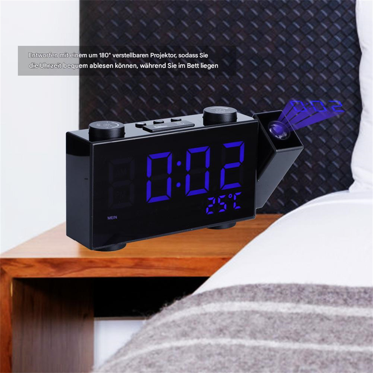 Eine schwarze Digitaluhr mit blauem Display zeigt Zeit und Temperatur an.