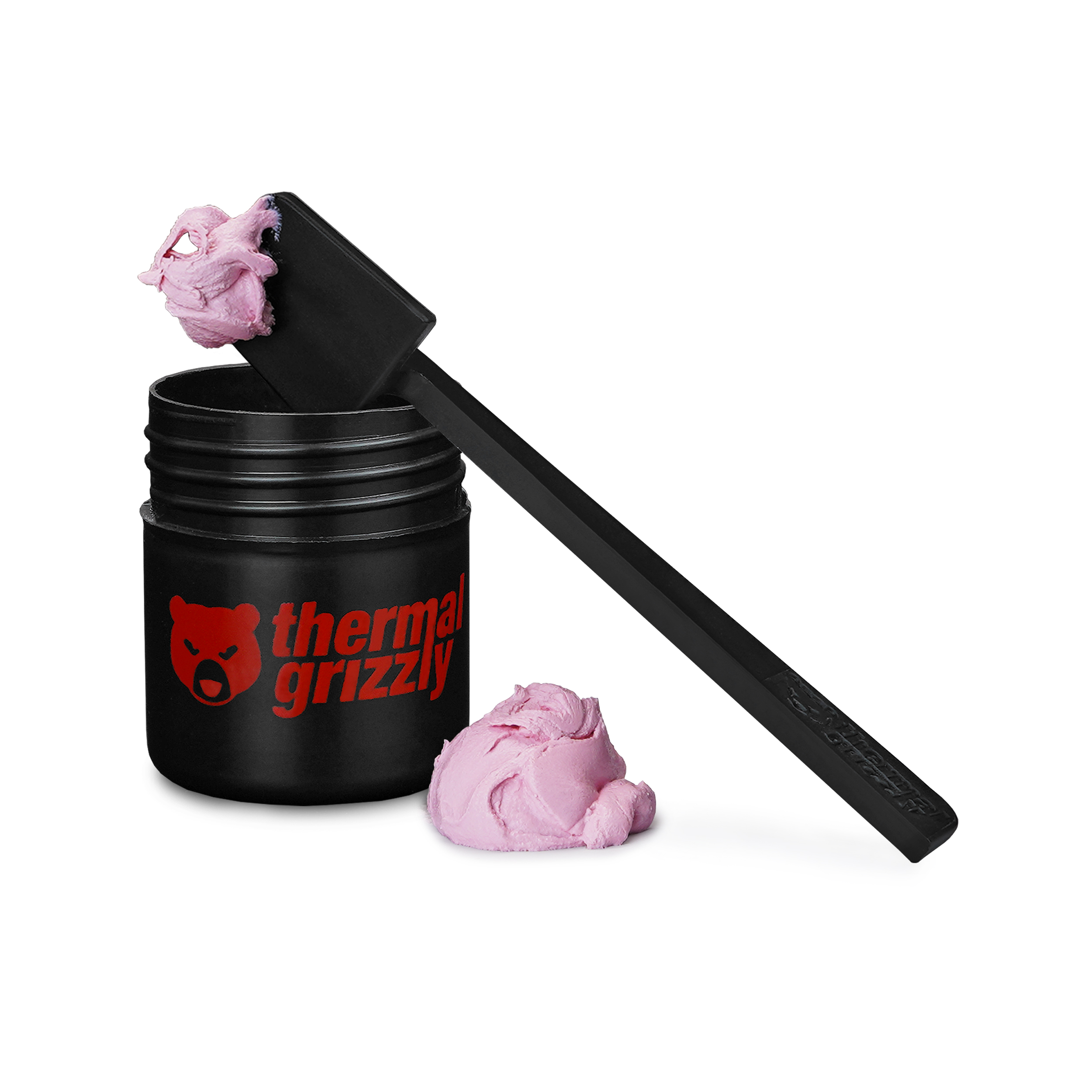 Schwarzes Glas mit rosa Wärmeleitpaste und Applikator. Weißer Hintergrund.