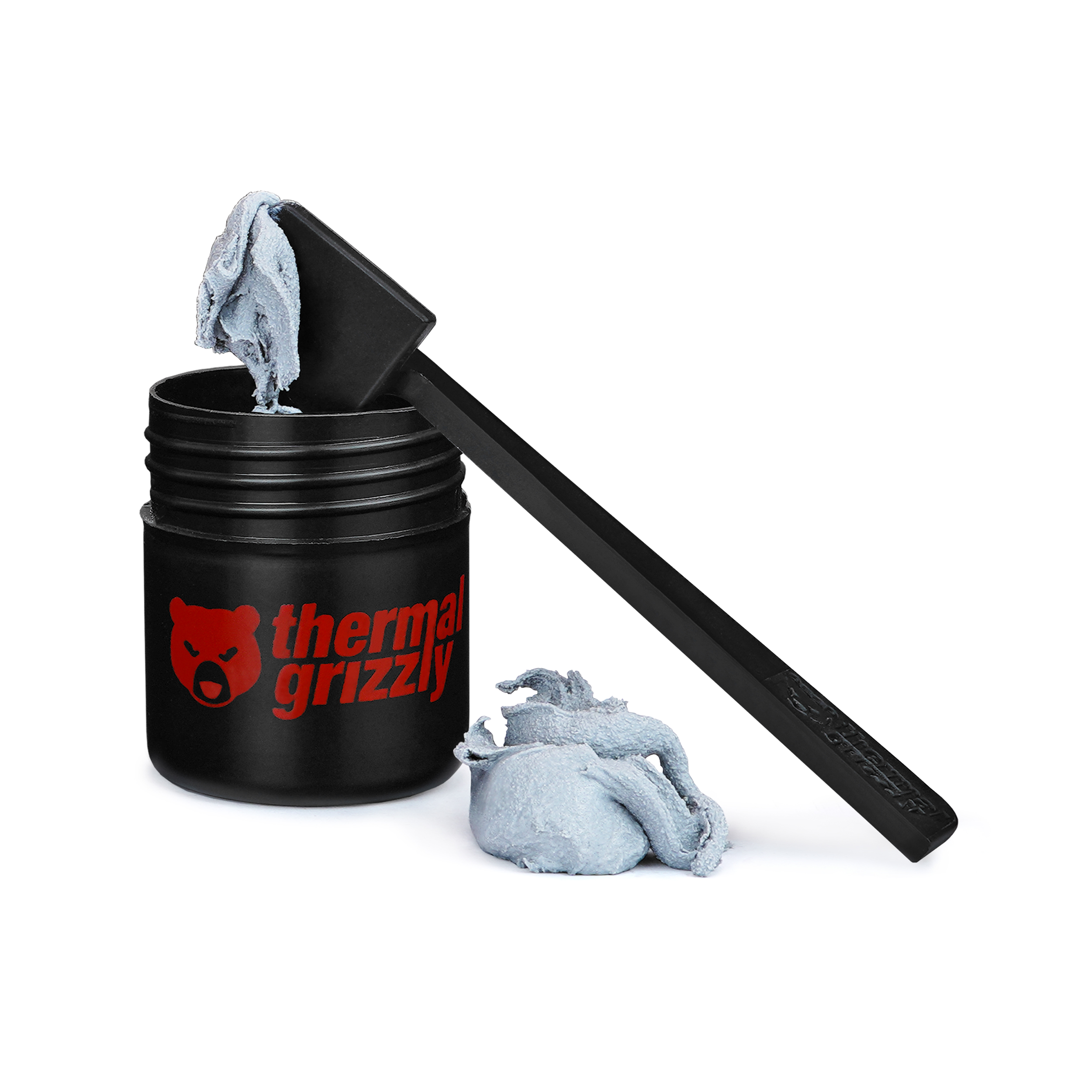 Schwarzes Wärmeleitpasten-Glas, Applikator und eine kleine Menge Paste.
