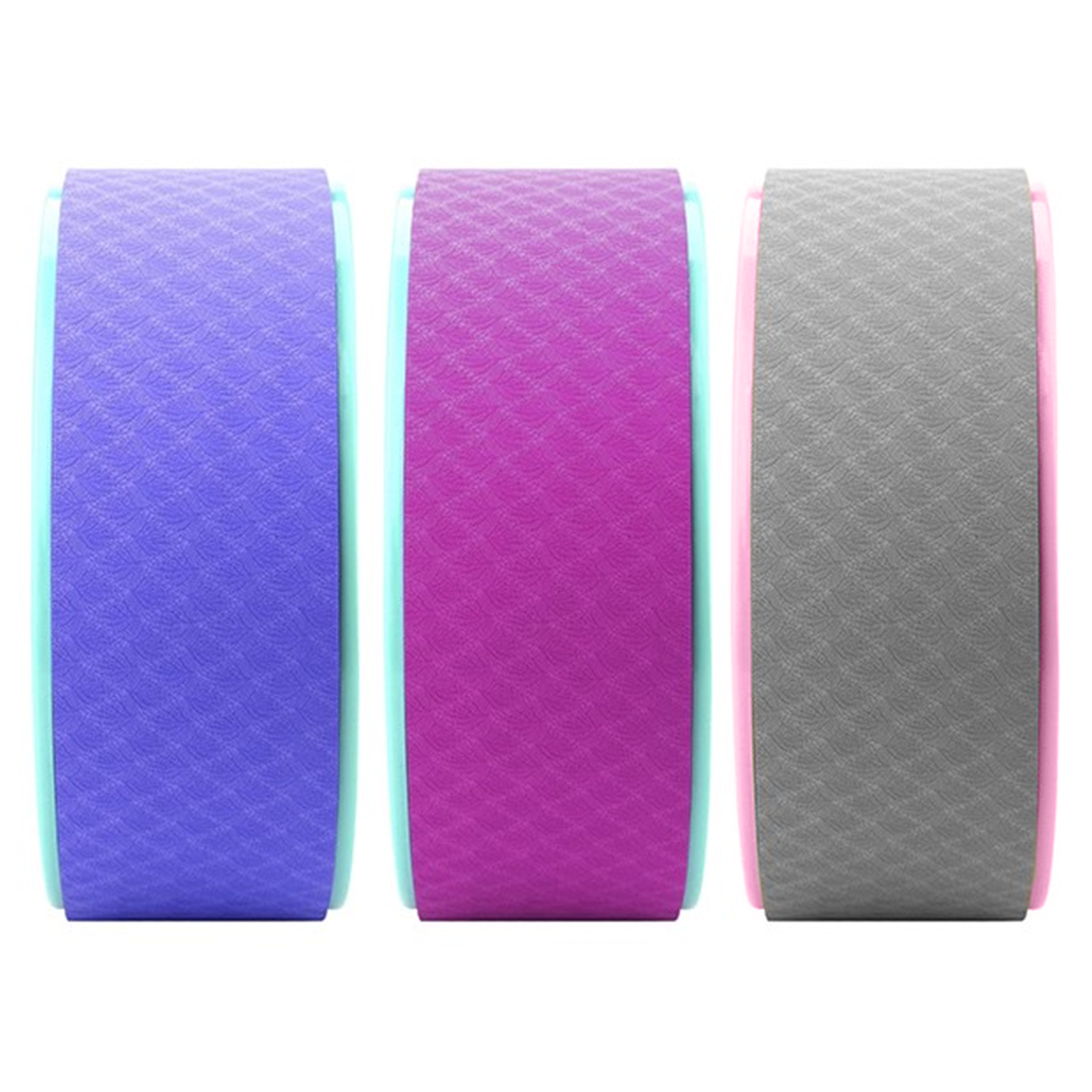 Tres ruedas de yoga en morado, rosa y gris con borde turquesa.