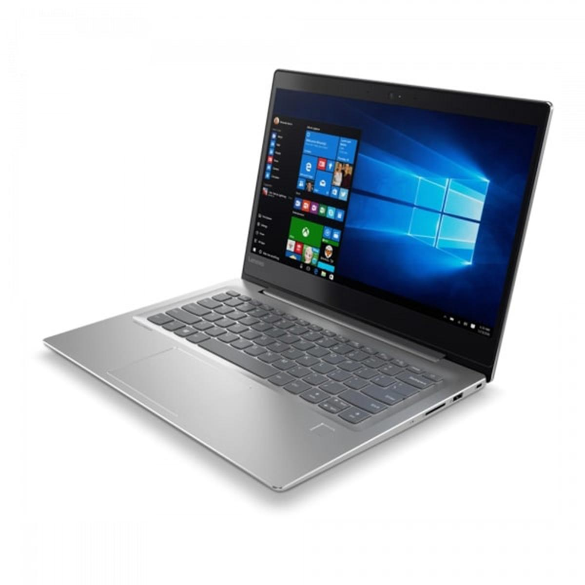 Srebrny laptop, otwarty, pokazujący interfejs Windows na białym tle.