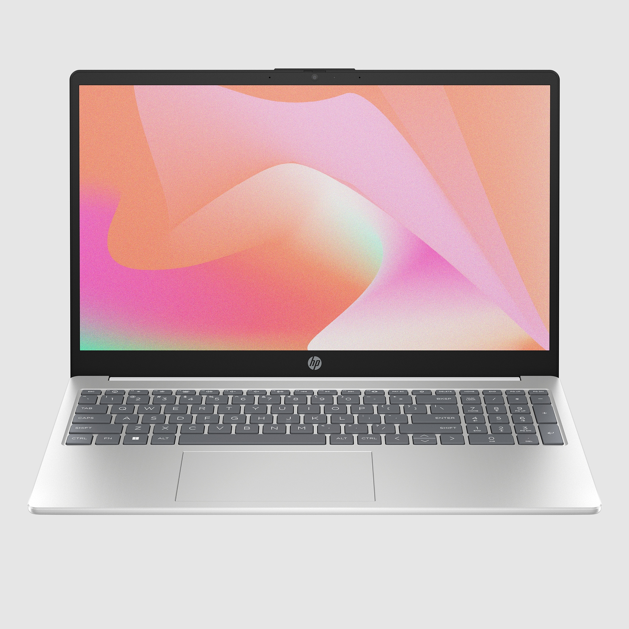 Un laptop argentato con uno schermo colorato che mostra forme astratte.