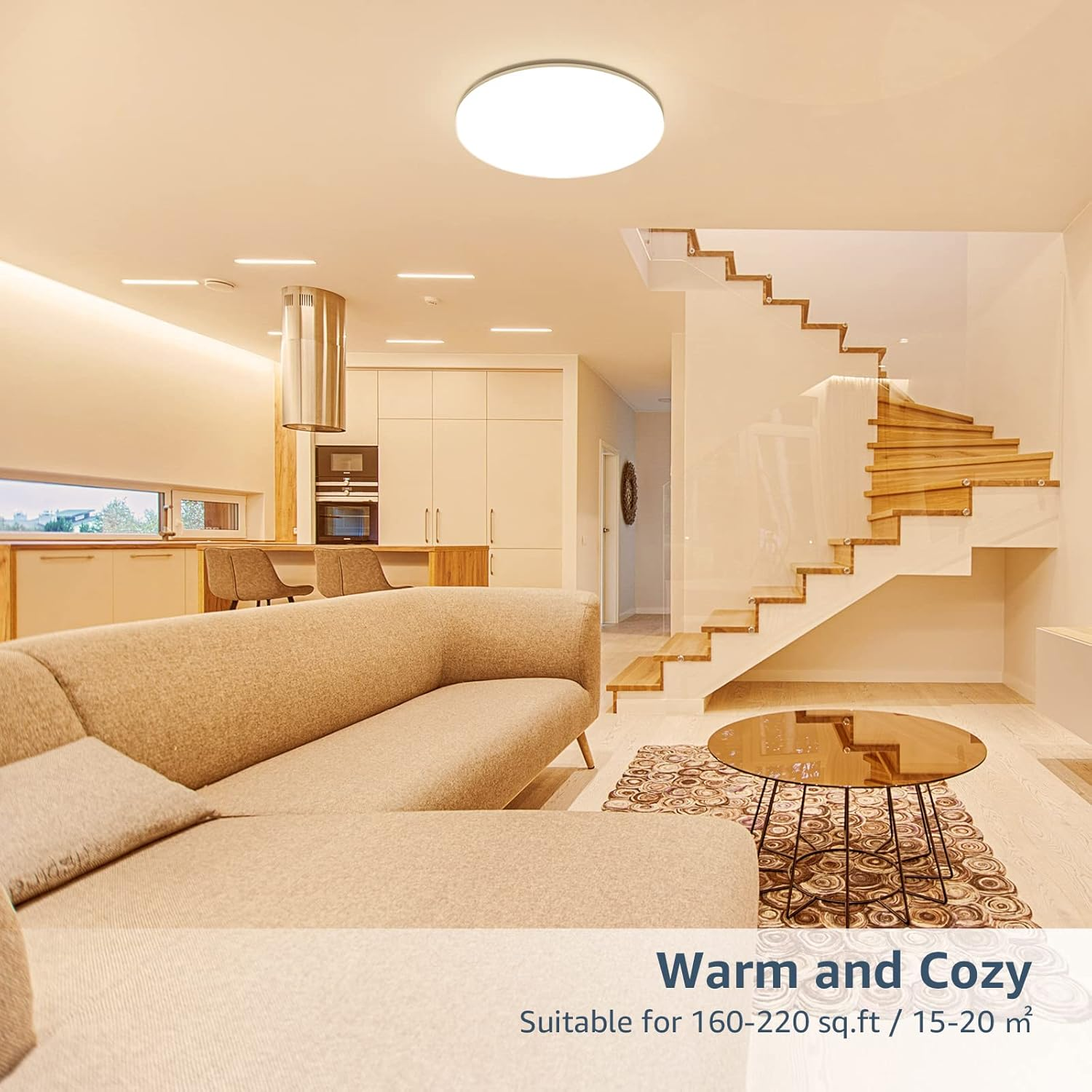 Modernes Wohnzimmer mit Sofa, rundem Tisch und Wendeltreppe.