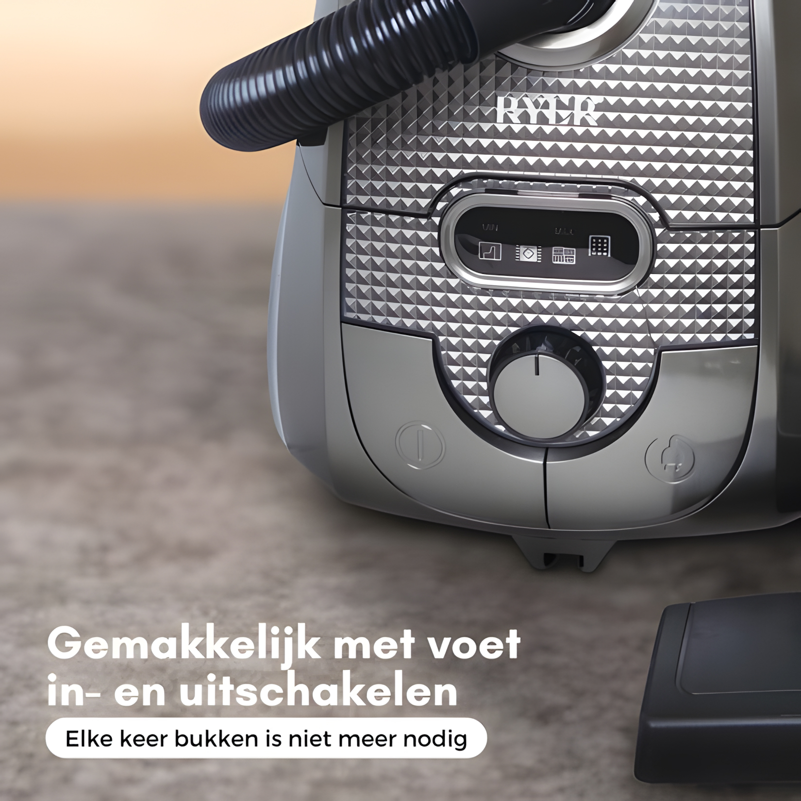 Een close-up van een zilveren stofzuiger met bedieningsknoppen en een draaiknop.