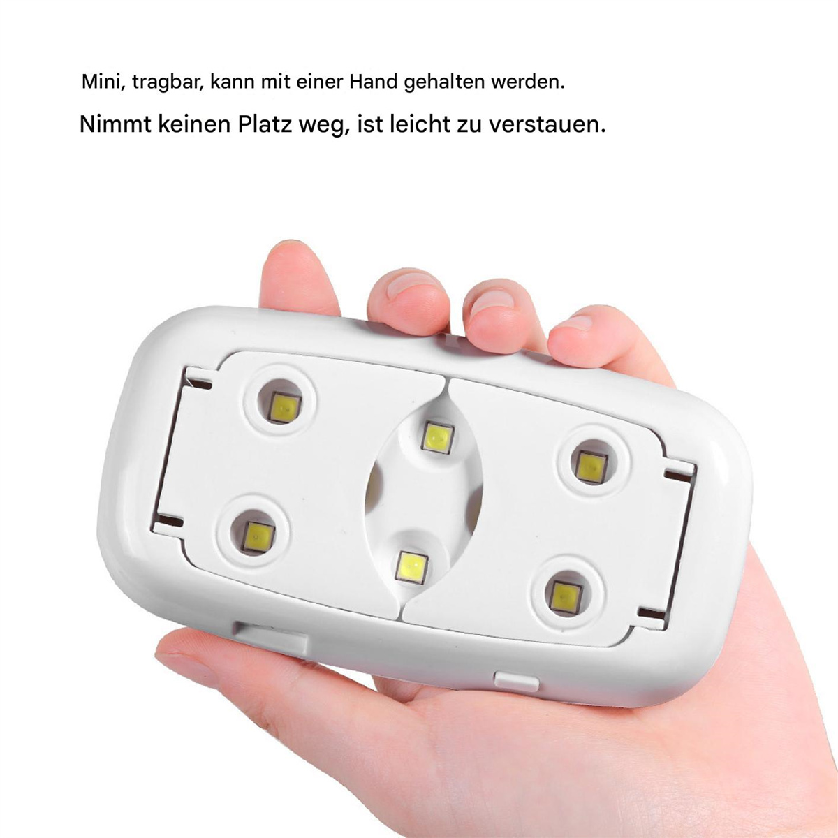 Hand, die eine weiße Nagellampe mit vier LEDs hält. Text auf Deutsch.