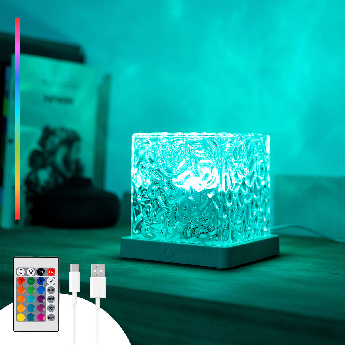 Würfelförmige LED-Lampe mit strukturierter Oberfläche. Sie steht auf einer weißen Basis und hat Farben.