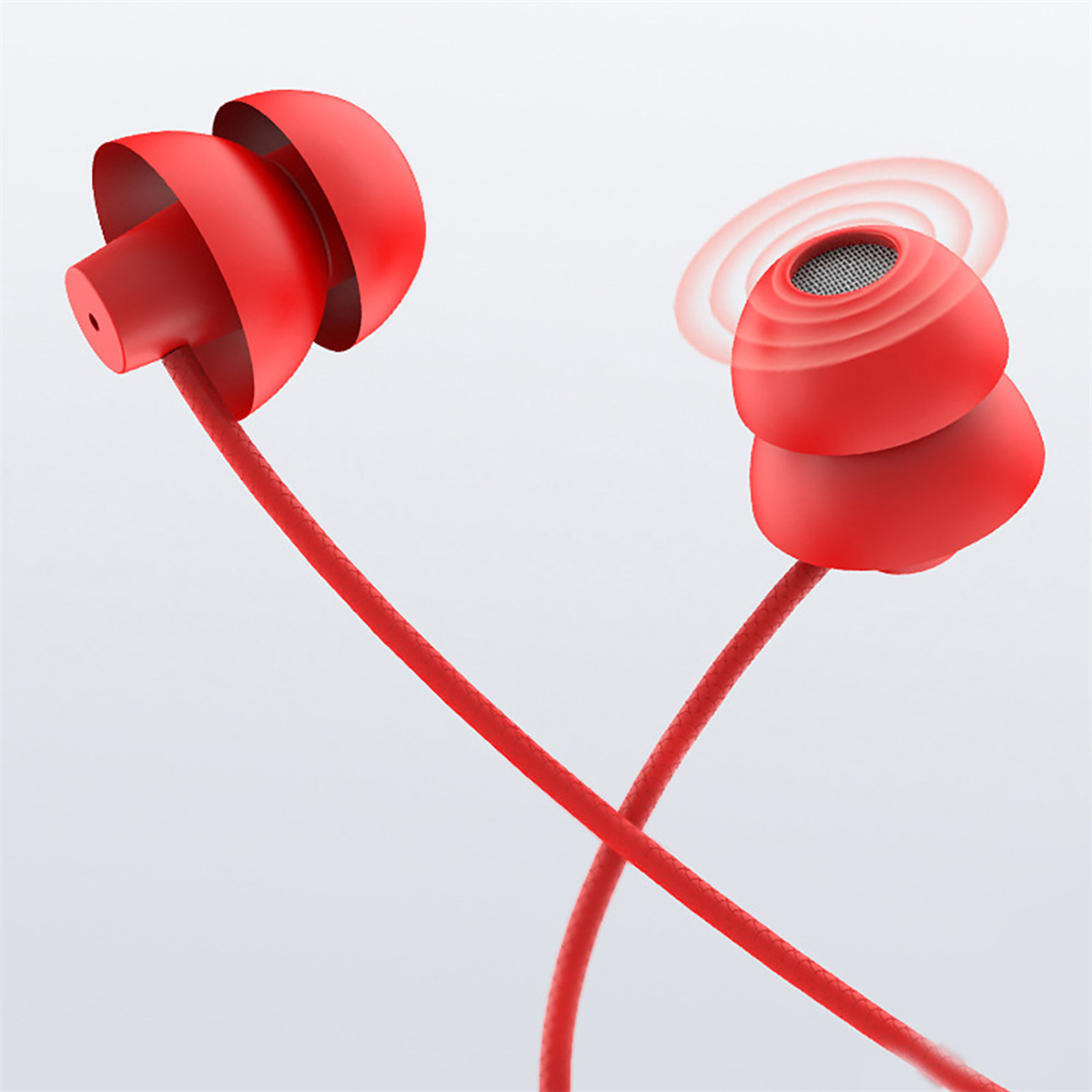 Rote Ohrhörer mit rotem Kabel. Ein Ohrhörer zeigt Schallwellen.