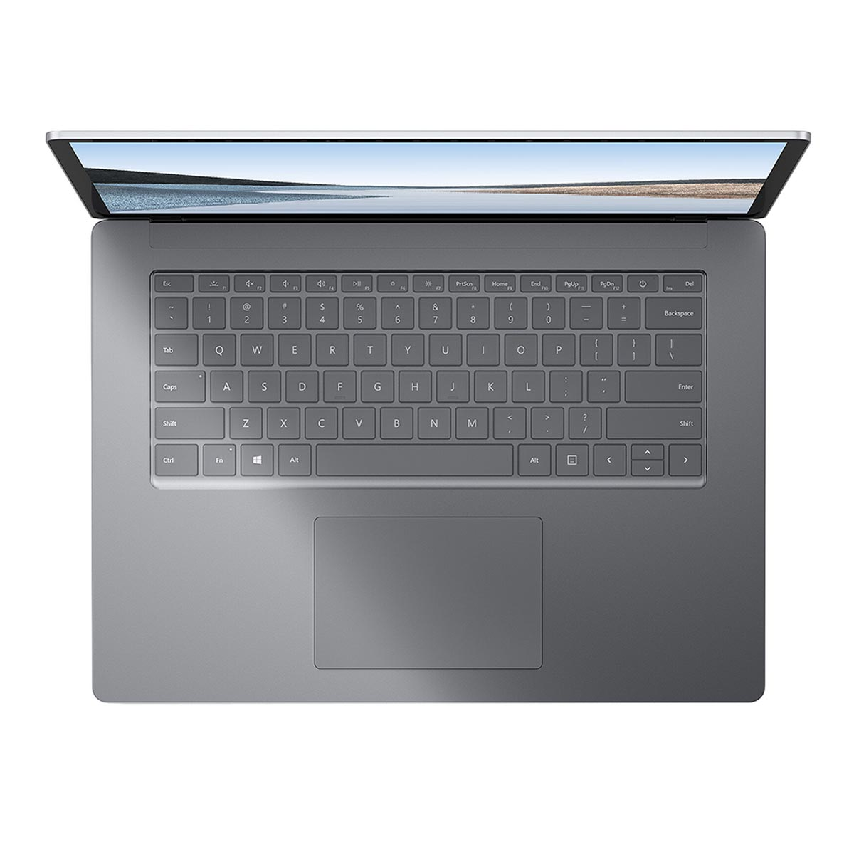 Widok z góry na szary laptop z otwartym ekranem, pokazujący klawiaturę i gładzik.