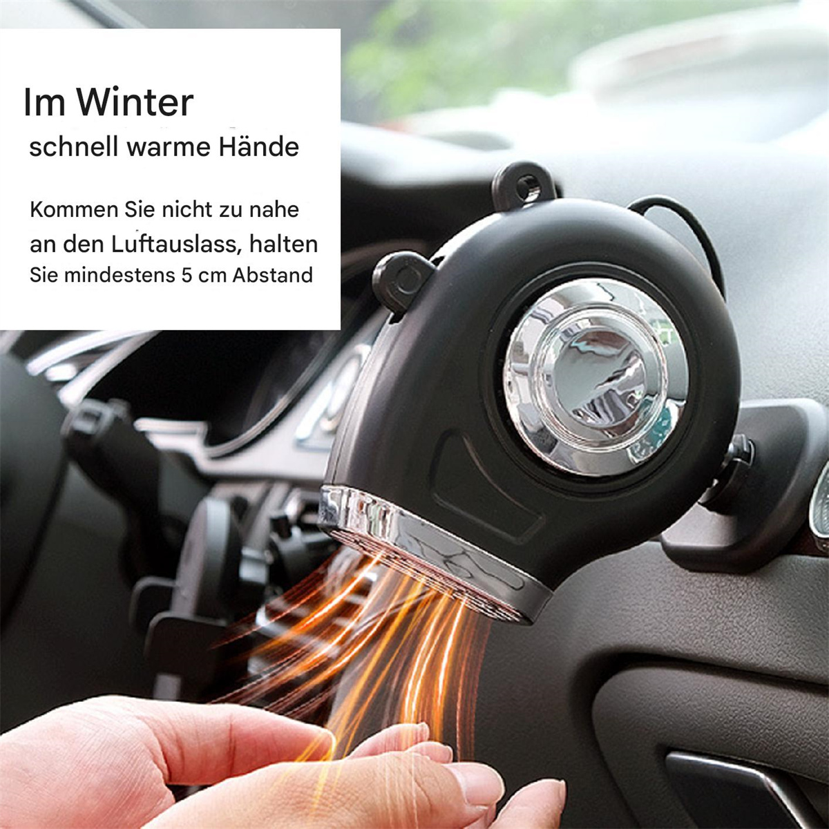 Eine schwarze Autoheizung lenkt warme Luft auf eine Hand. Text auf Deutsch warnt vor Vorsicht.