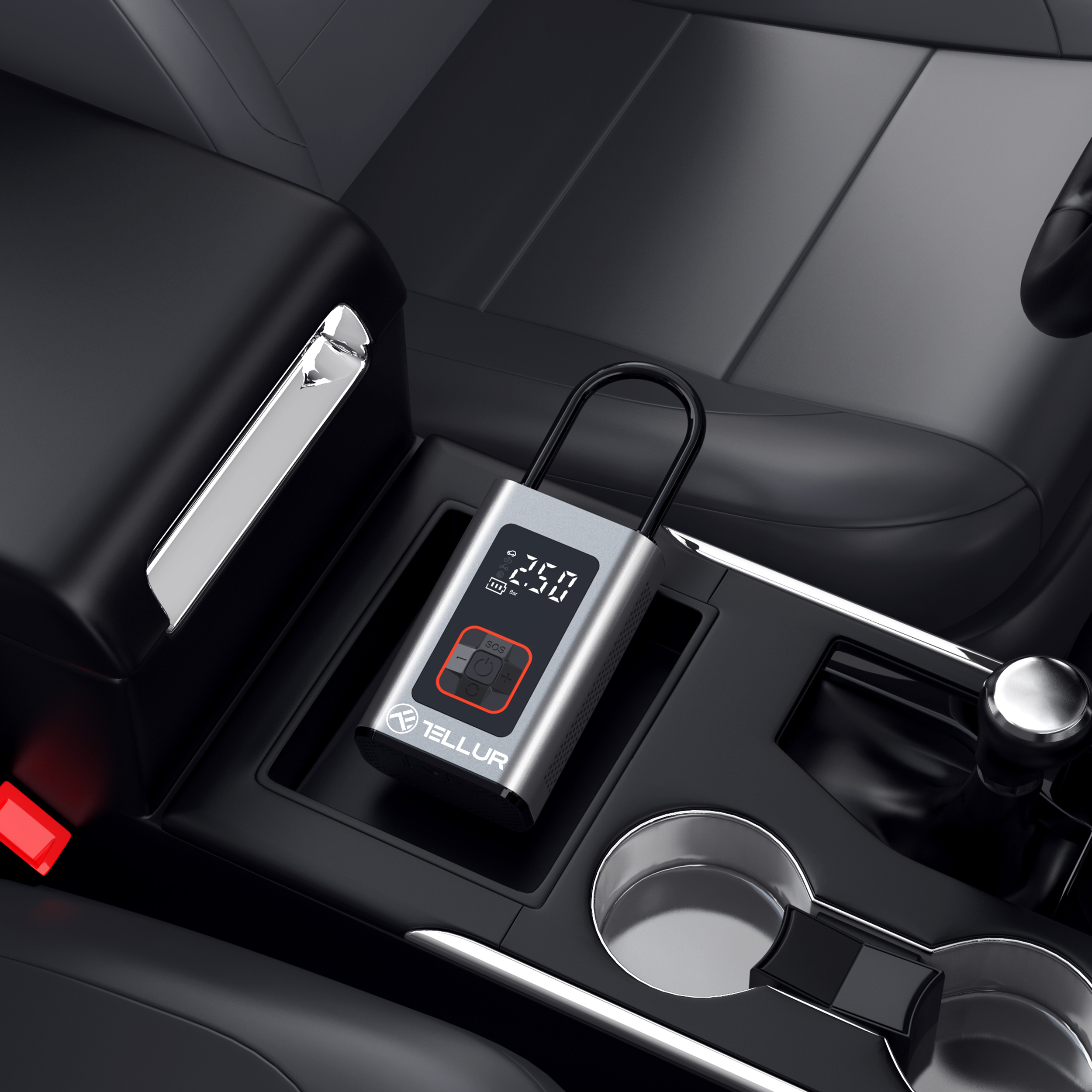 Srebrno-czarny inflator opon w konsoli samochodowej, z cyfrowym wyświetlaczem pokazującym 2.50.