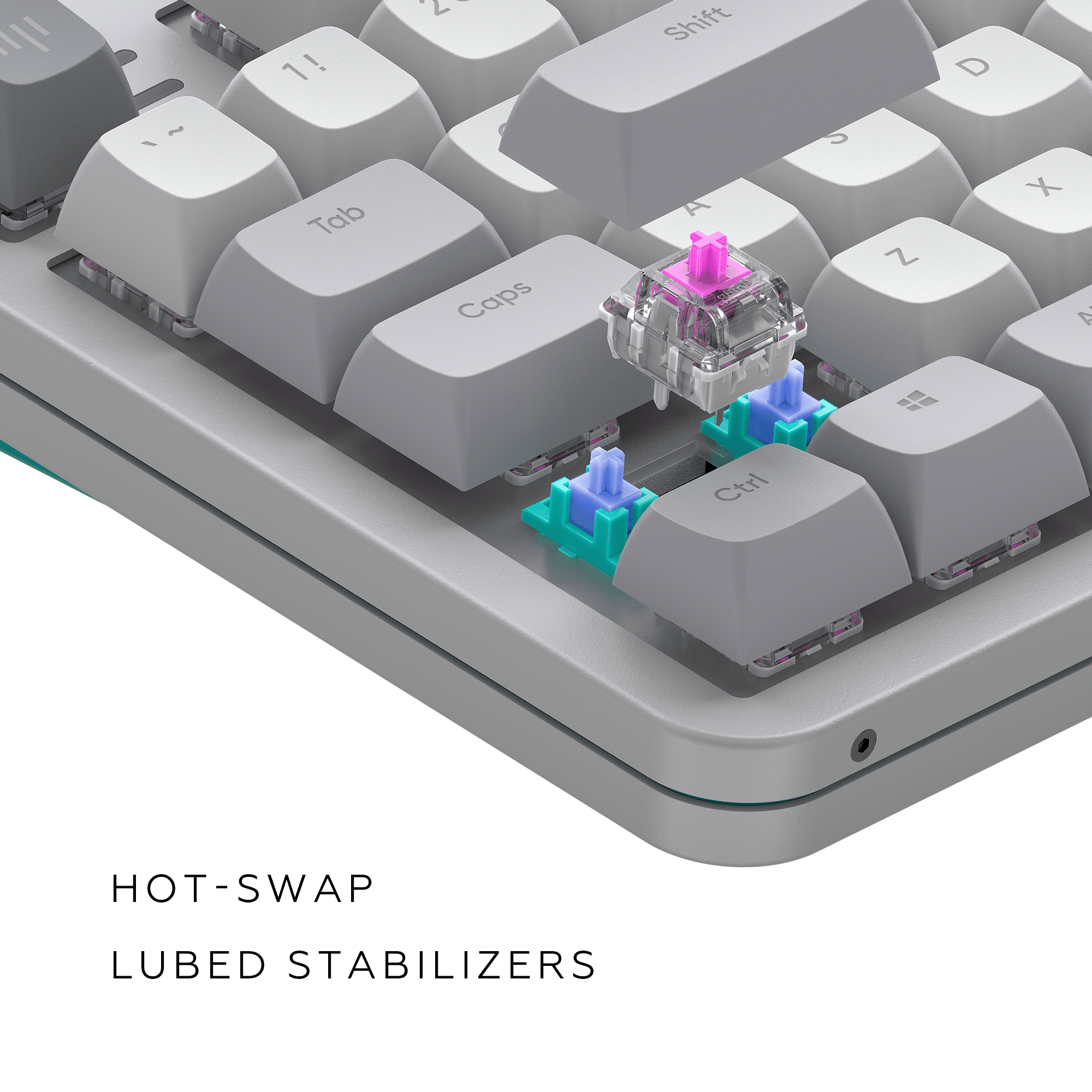 Nahaufnahme einer Tastatur mit abnehmbaren Tastenkappen und einem rosa Schalter.