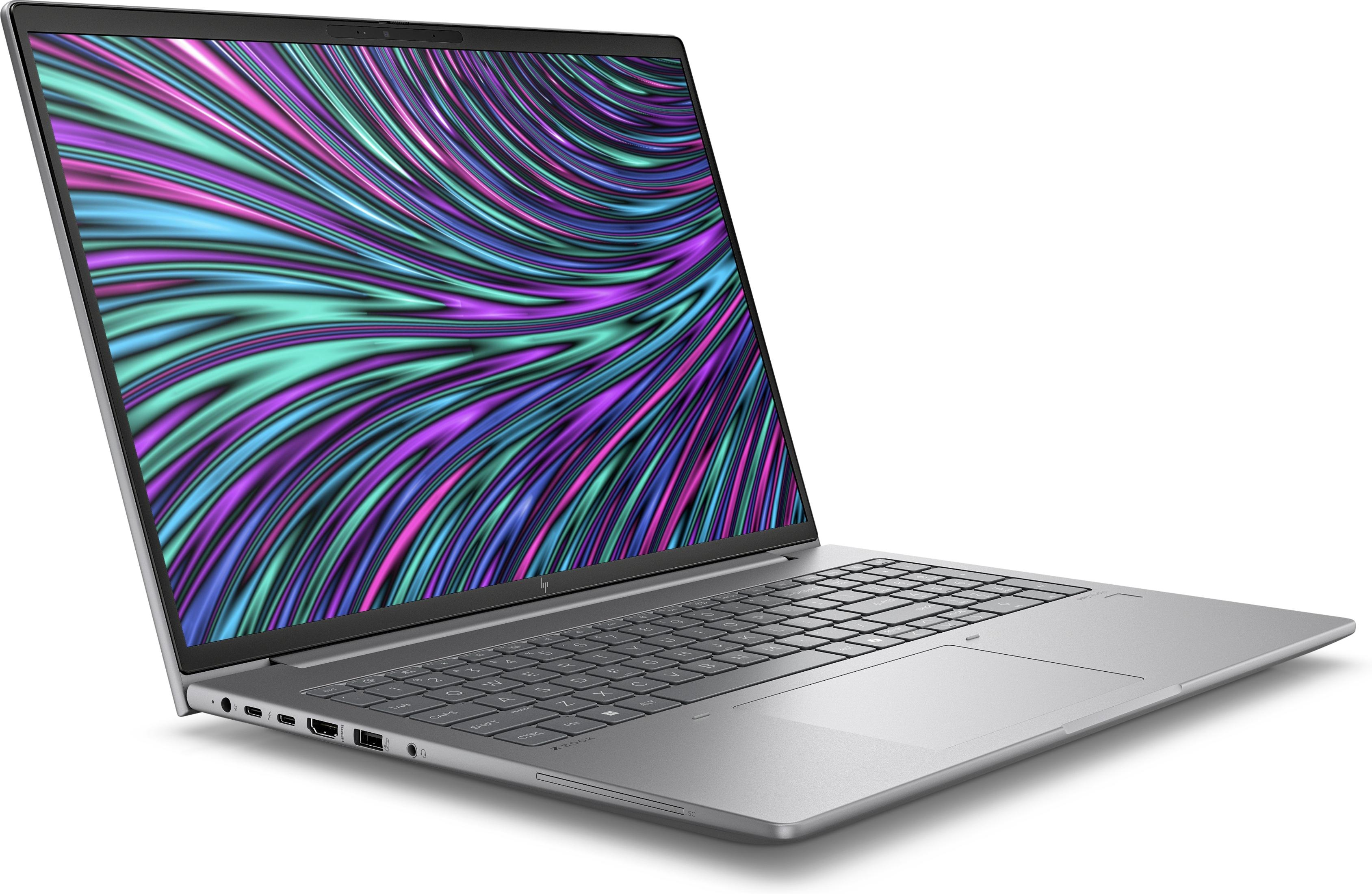 Silberner Laptop auf weißer Oberfläche, zeigt geöffneten Bildschirm mit bunter abstrakter Kunst.