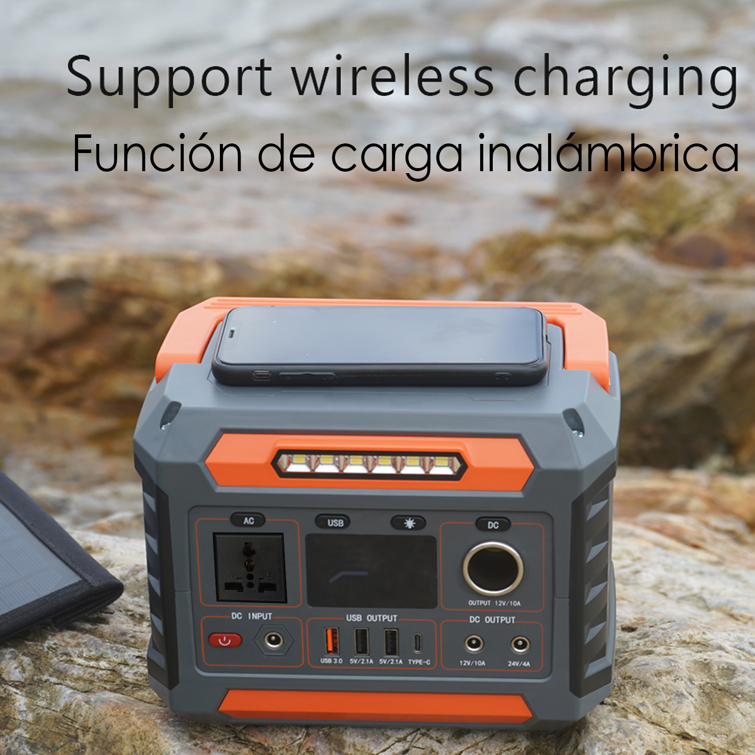 Estación de energía naranja y gris con teléfono encima. Texto: carga inalámbrica.