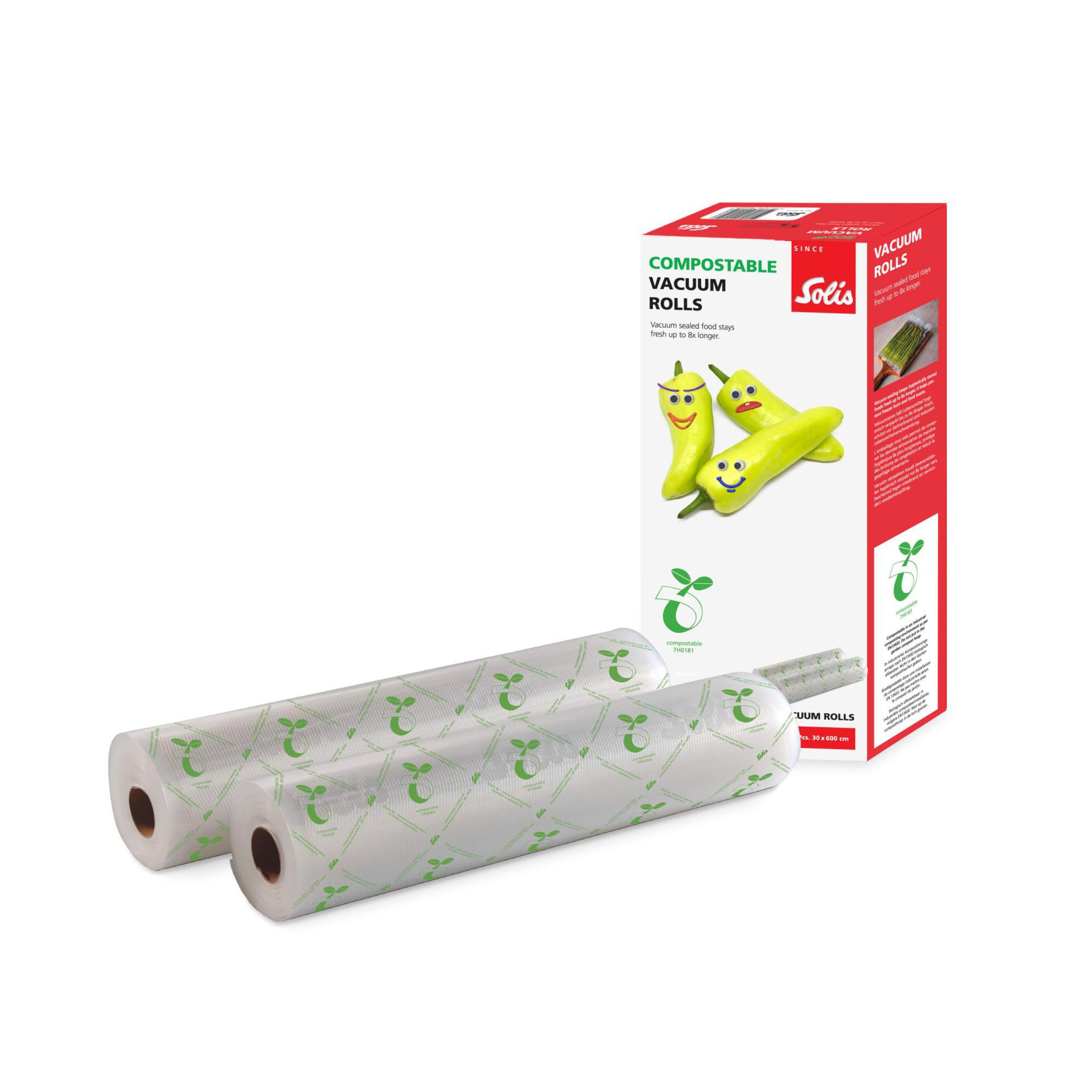 Due rotoli di sacchetti per sottovuoto e una scatola. La scatola ha un'immagine di verdure.
